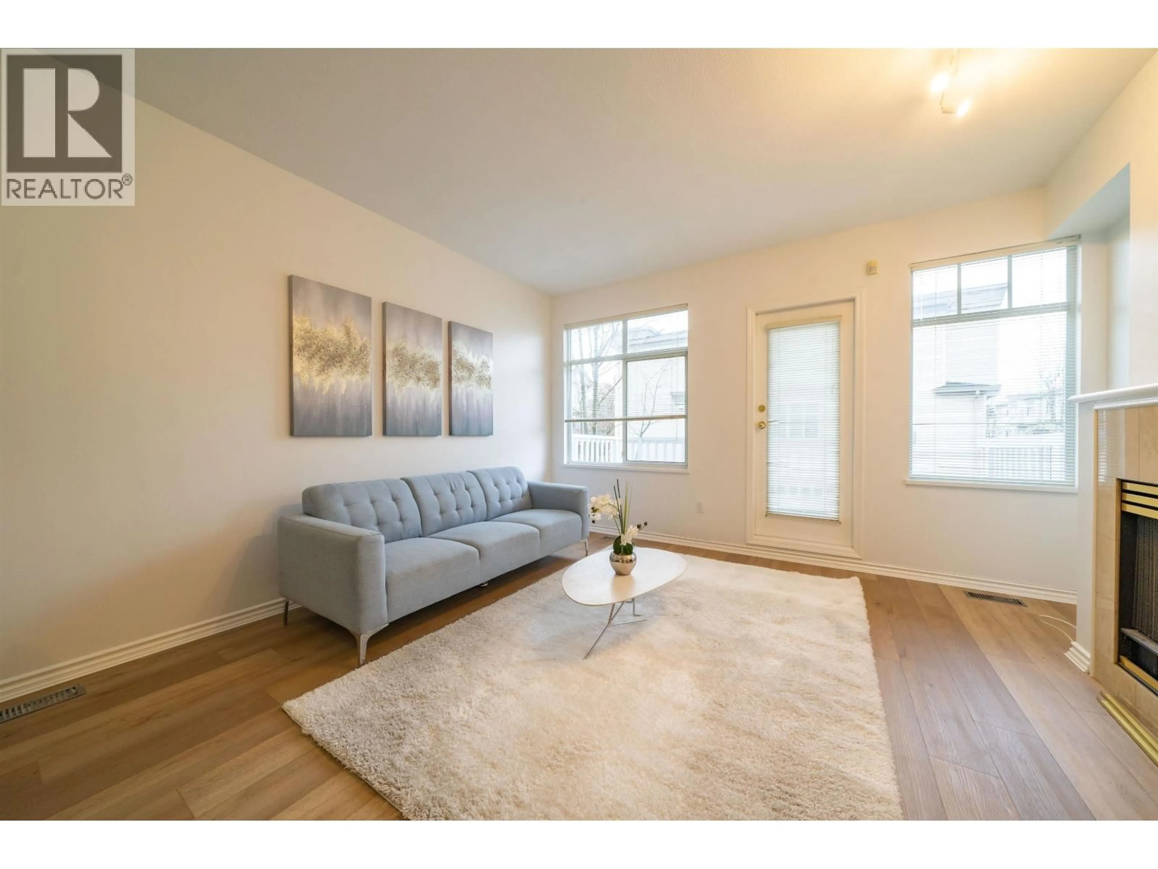 Living room with furniture, wood/laminate floor for 30 - 6179 NO. 1 ROAD, Richmond British Columbia V7C1T4