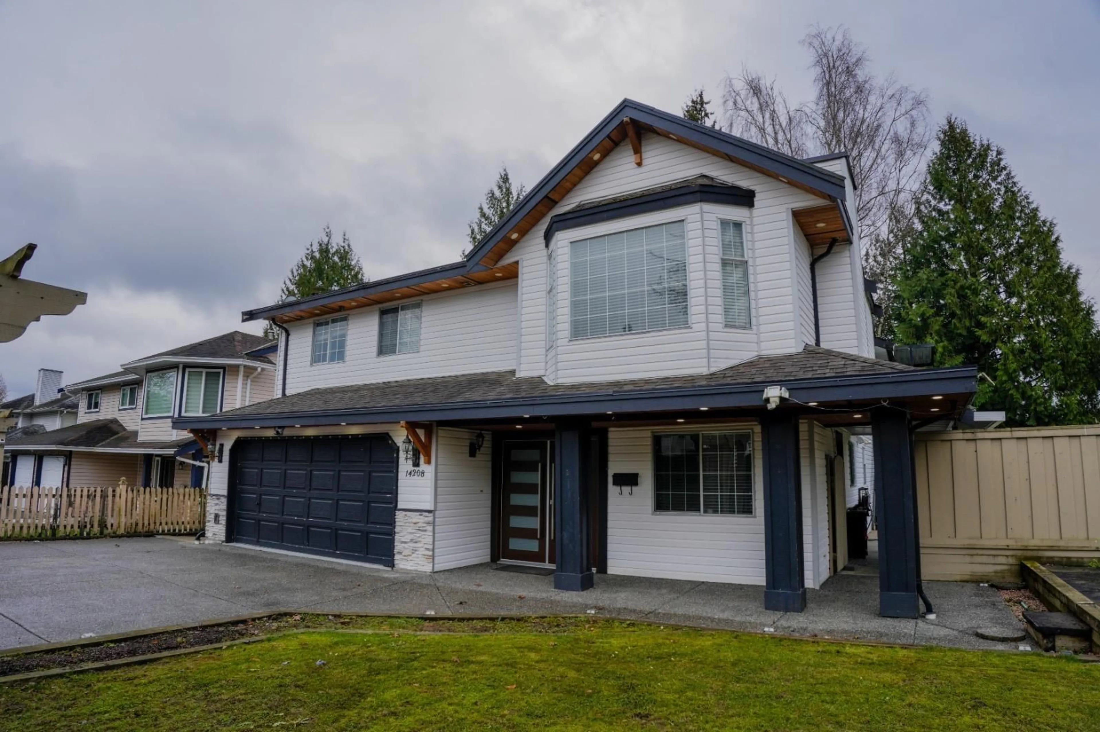 Home with vinyl exterior material, street for 14208 67 AVENUE, Surrey British Columbia V3W0P5