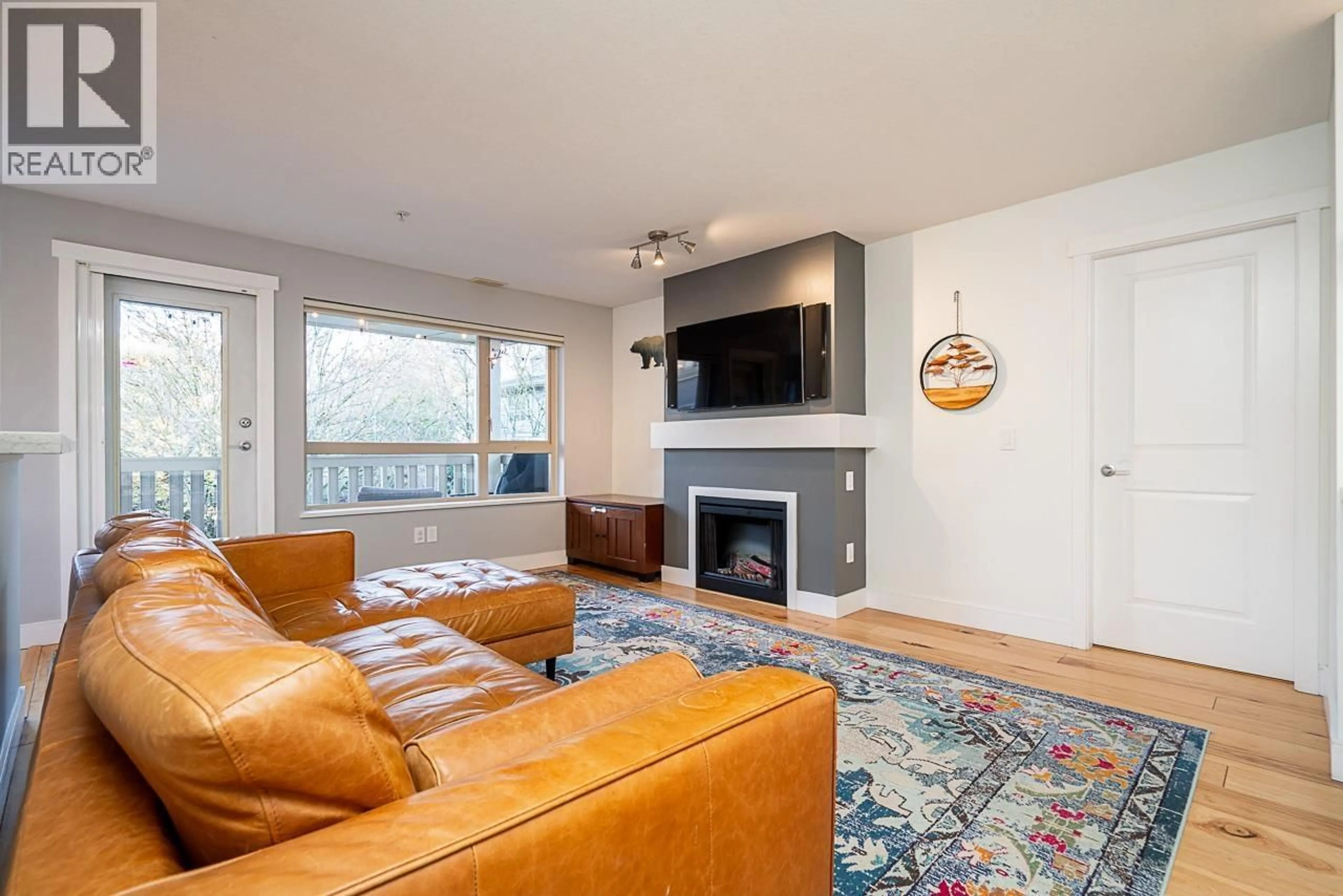 Living room with furniture, wood/laminate floor for 315 - 801 KLAHANIE DRIVE, Port Moody British Columbia V3H5K4