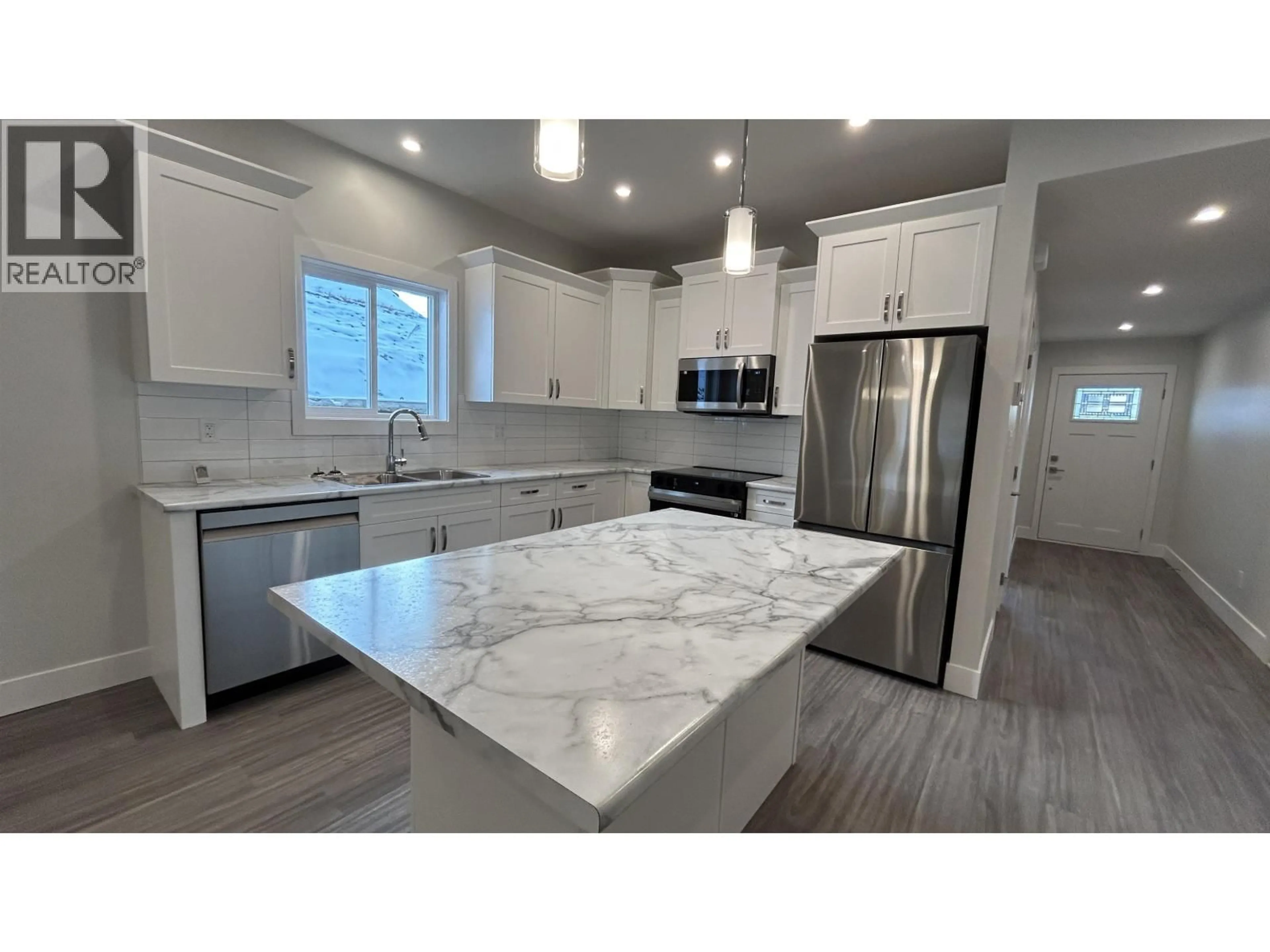 Open concept kitchen, ceramic/tile floor for 13 - 105 FOREST RIDGE ROAD, 100 Mile House British Columbia V0K2E0
