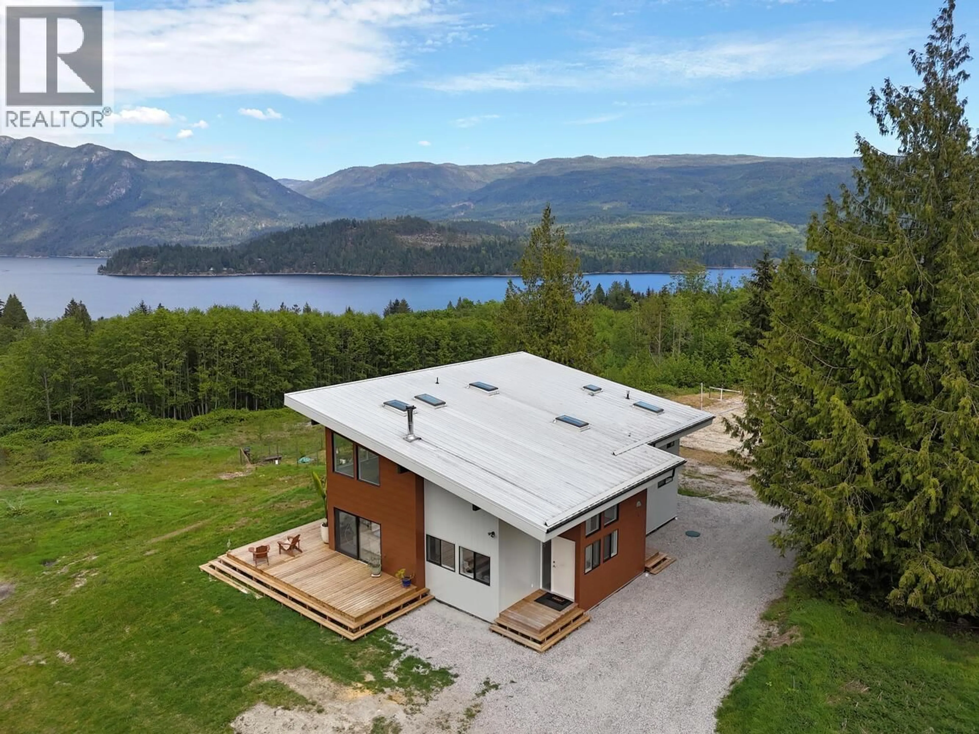 A pic from outside/outdoor area/front of a property/back of a property/a pic from drone, water/lake/river/ocean view for 6400 CROWSTON ROAD, Sechelt British Columbia V7Z0L1
