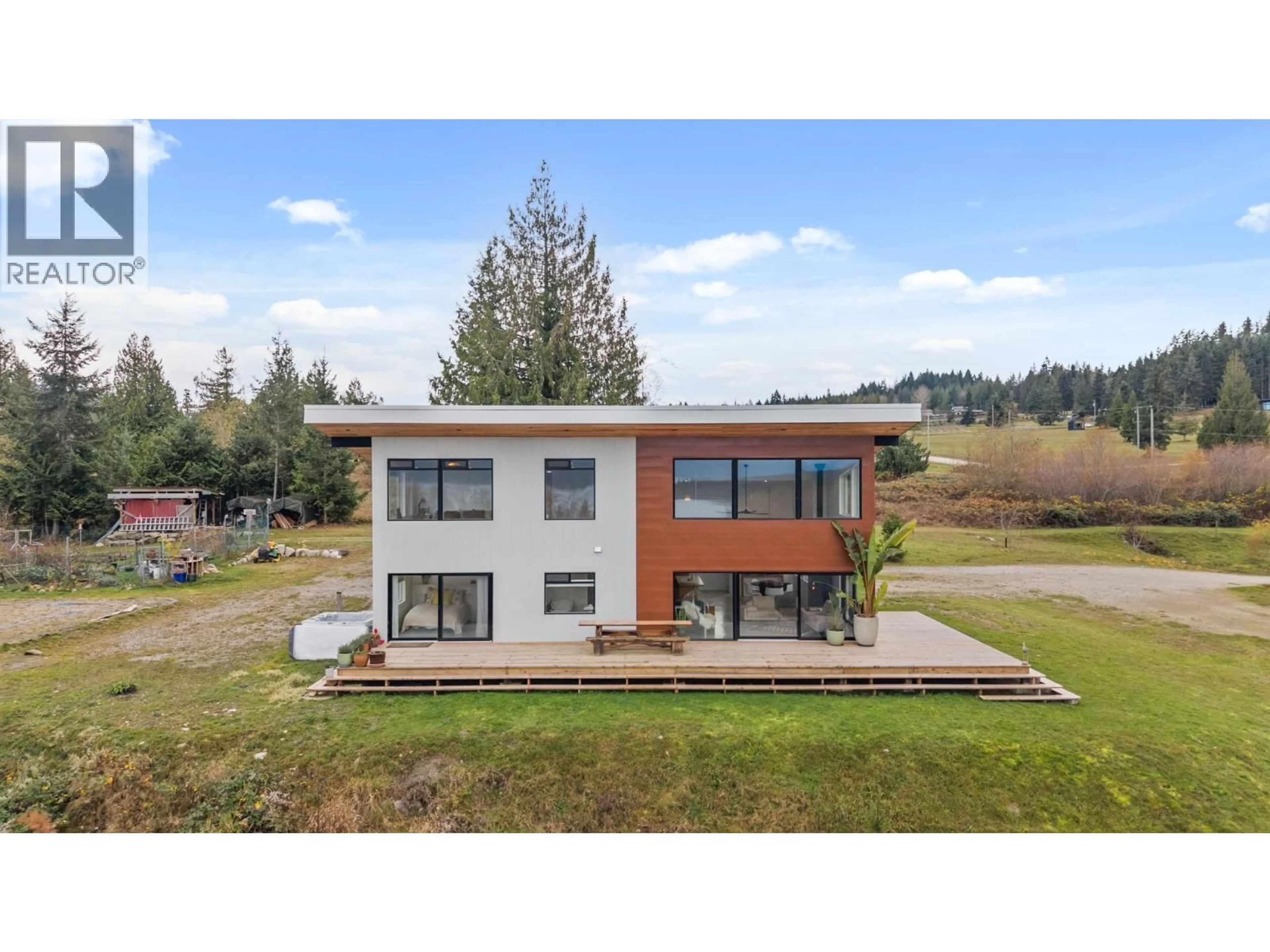 A pic from outside/outdoor area/front of a property/back of a property/a pic from drone, building for 6400 CROWSTON ROAD, Sechelt British Columbia V7Z0L1