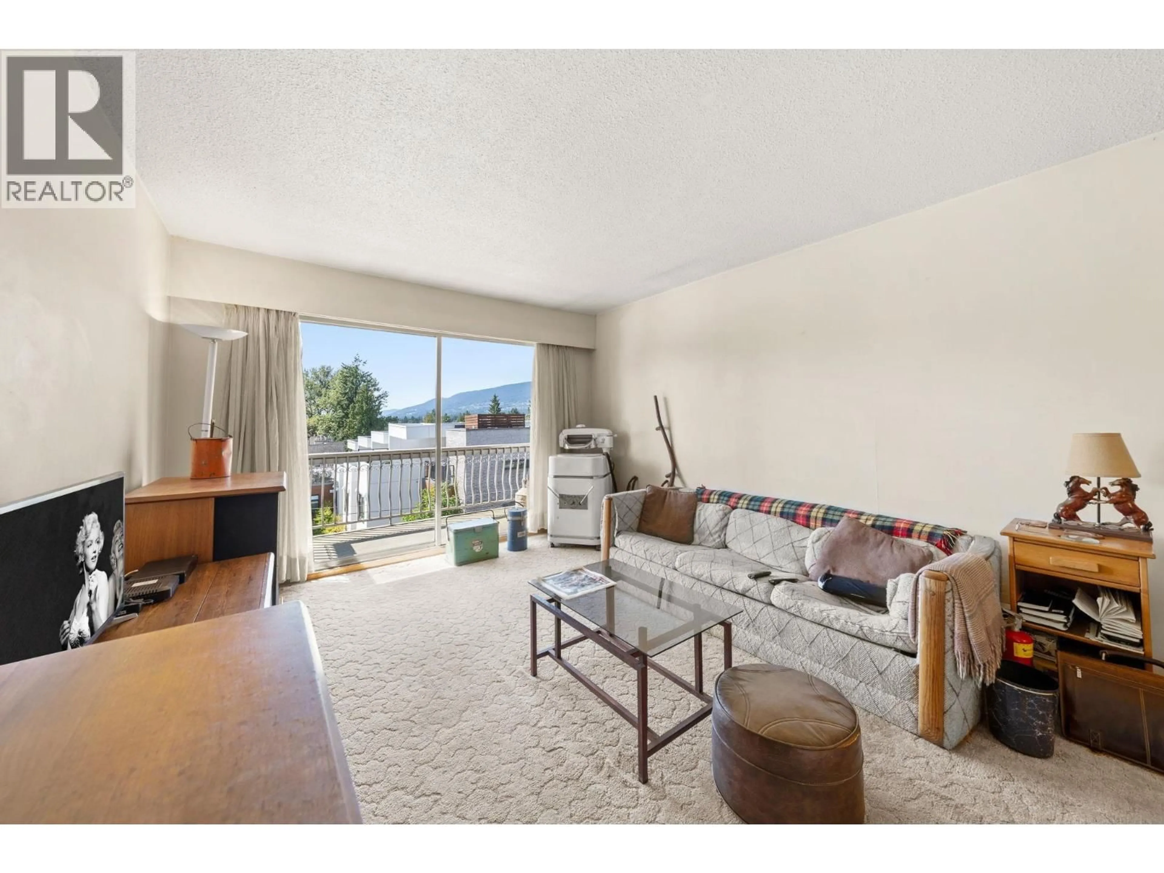 Living room with furniture, unknown for 309 - 135 21ST STREET, North Vancouver British Columbia V7M1Z2