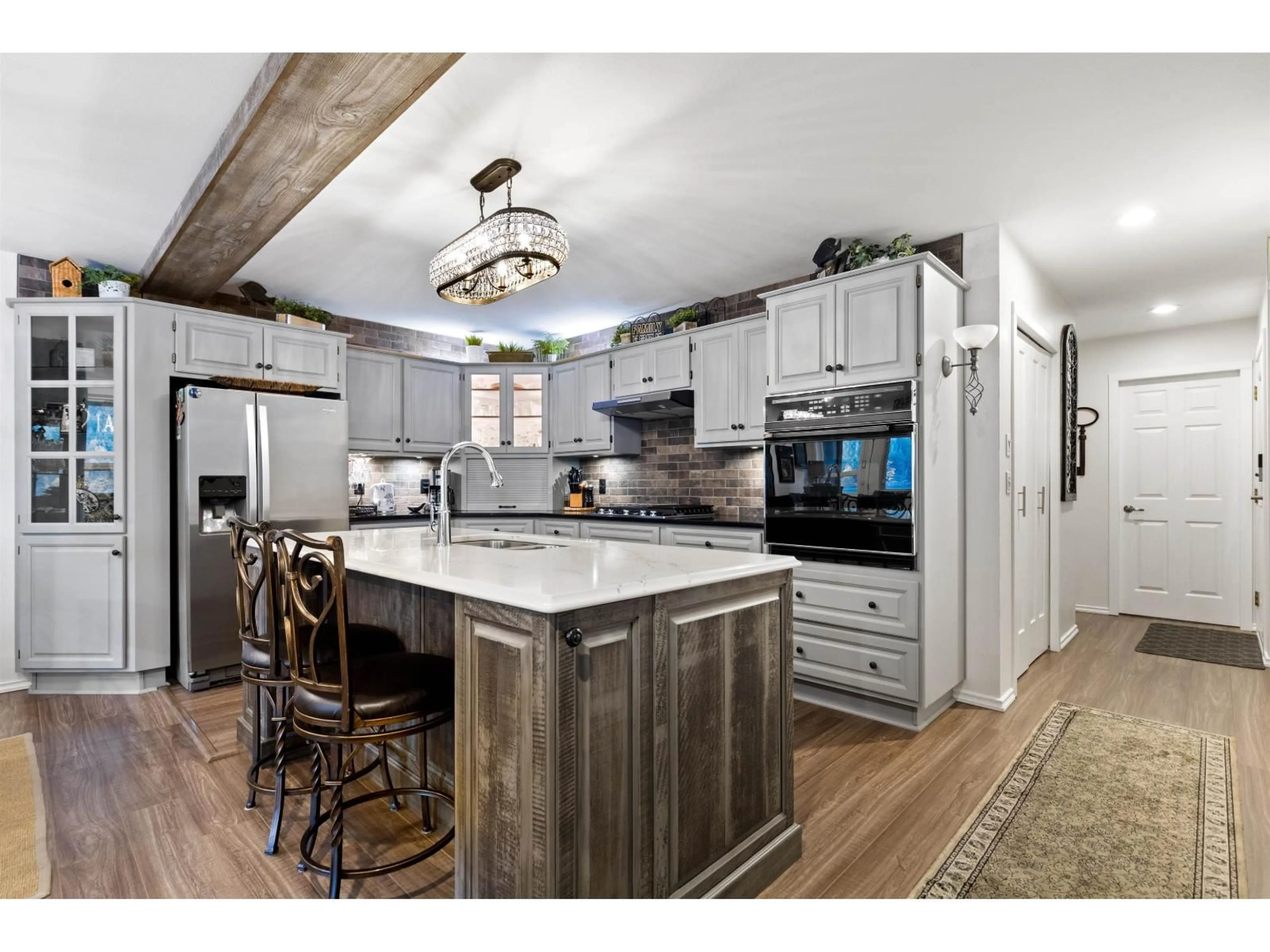 Open concept kitchen, wood/laminate floor for 173 FIRST AVENUE, Cultus Lake British Columbia V2R4Z4