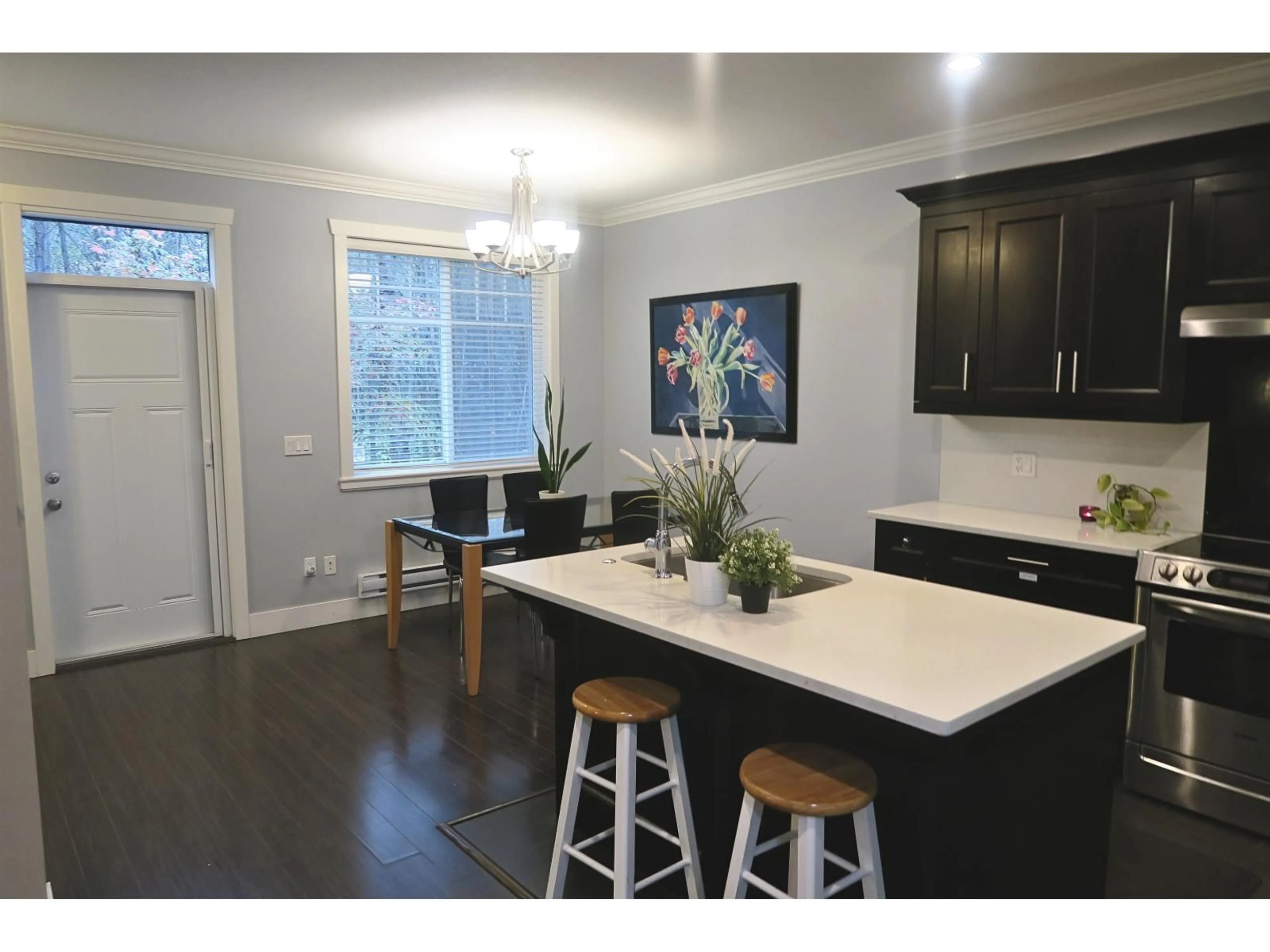 Open concept kitchen, wood/laminate floor for 118 - 15399 GUILDFORD DRIVE, Surrey British Columbia V3R7C6