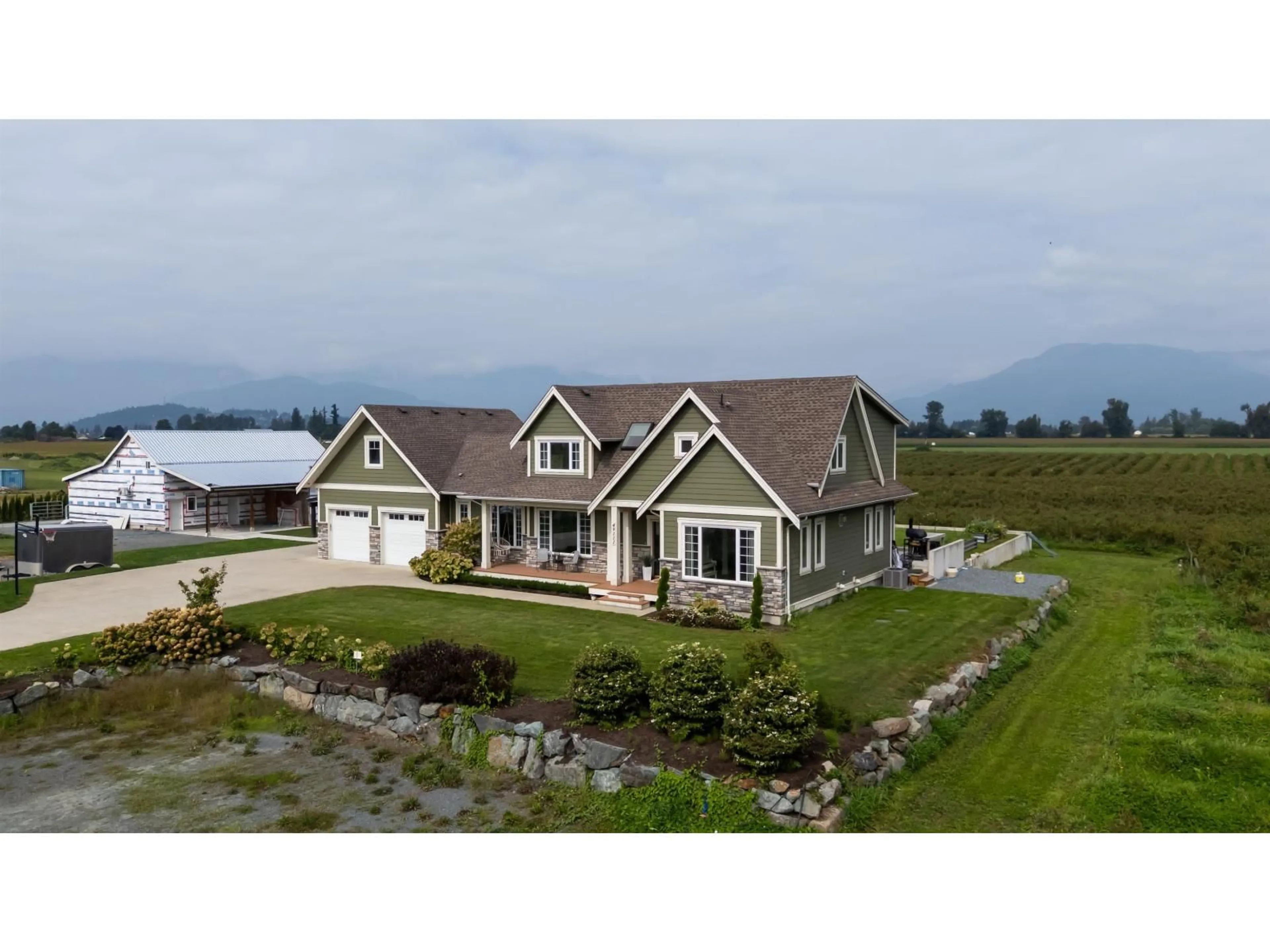A pic from outside/outdoor area/front of a property/back of a property/a pic from drone, water/lake/river/ocean view for 49111 CHILLIWACK CENTRAL ROAD, Chilliwack British Columbia V2P6H3