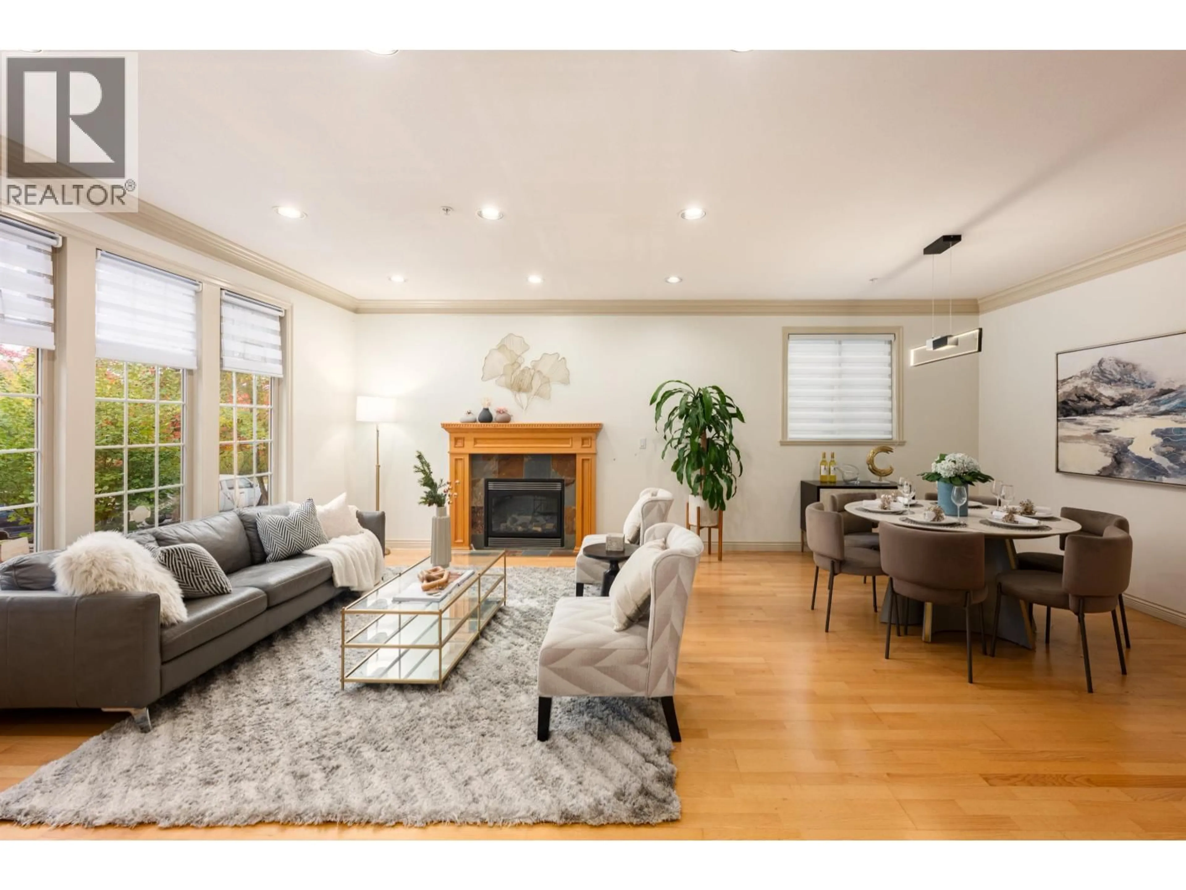 Living room with furniture, wood/laminate floor for 7949 MONTCALM STREET, Vancouver British Columbia V6P4P2