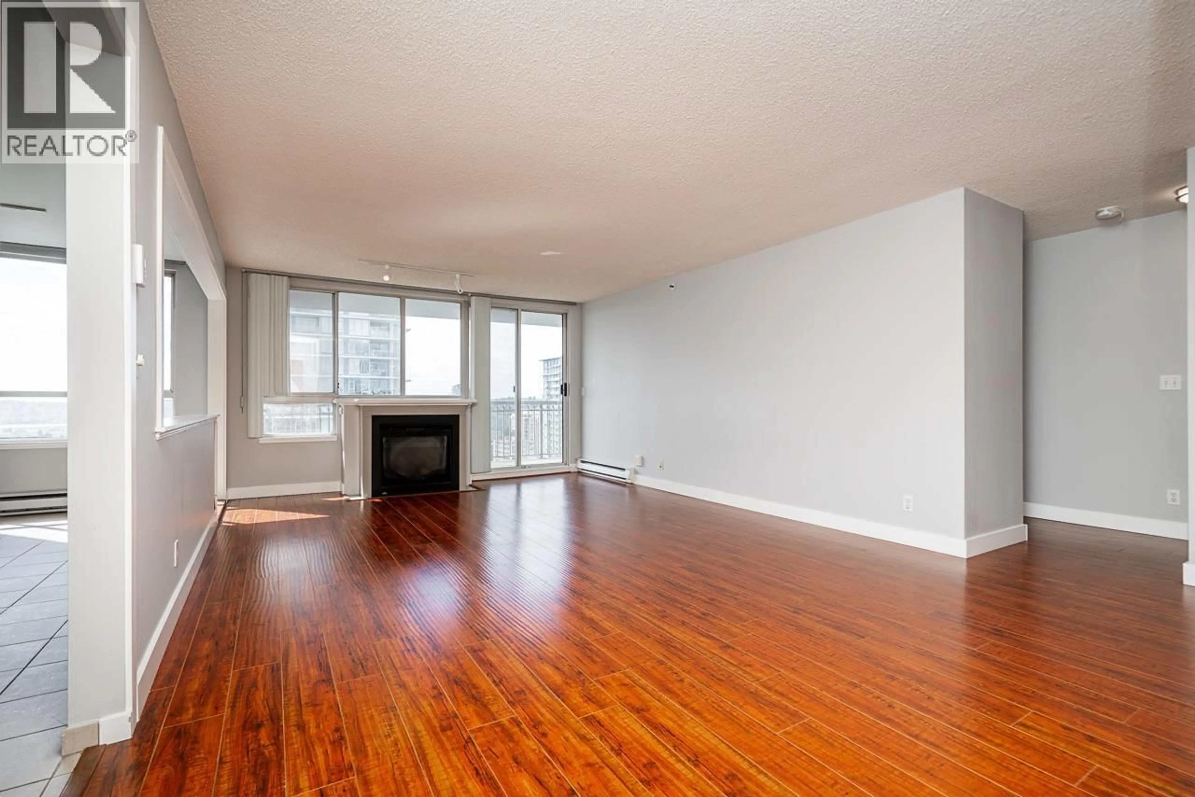 Living room with furniture, wood/laminate floor for 1501 - 555 AUSTIN AVENUE, Coquitlam British Columbia V3K3M6