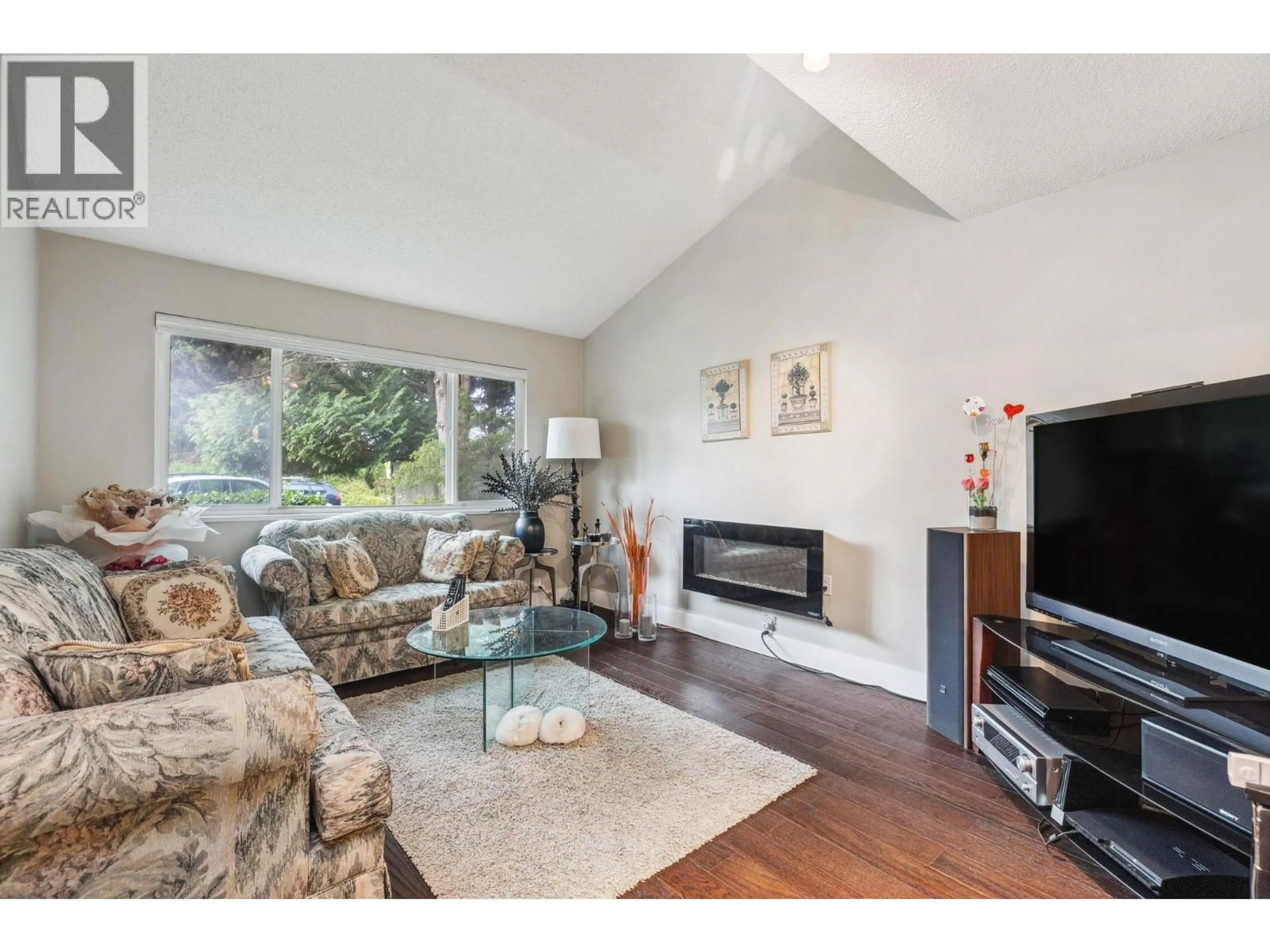 Living room with furniture, wood/laminate floor for 4231 CORLESS ROAD, Richmond British Columbia V7C1N1