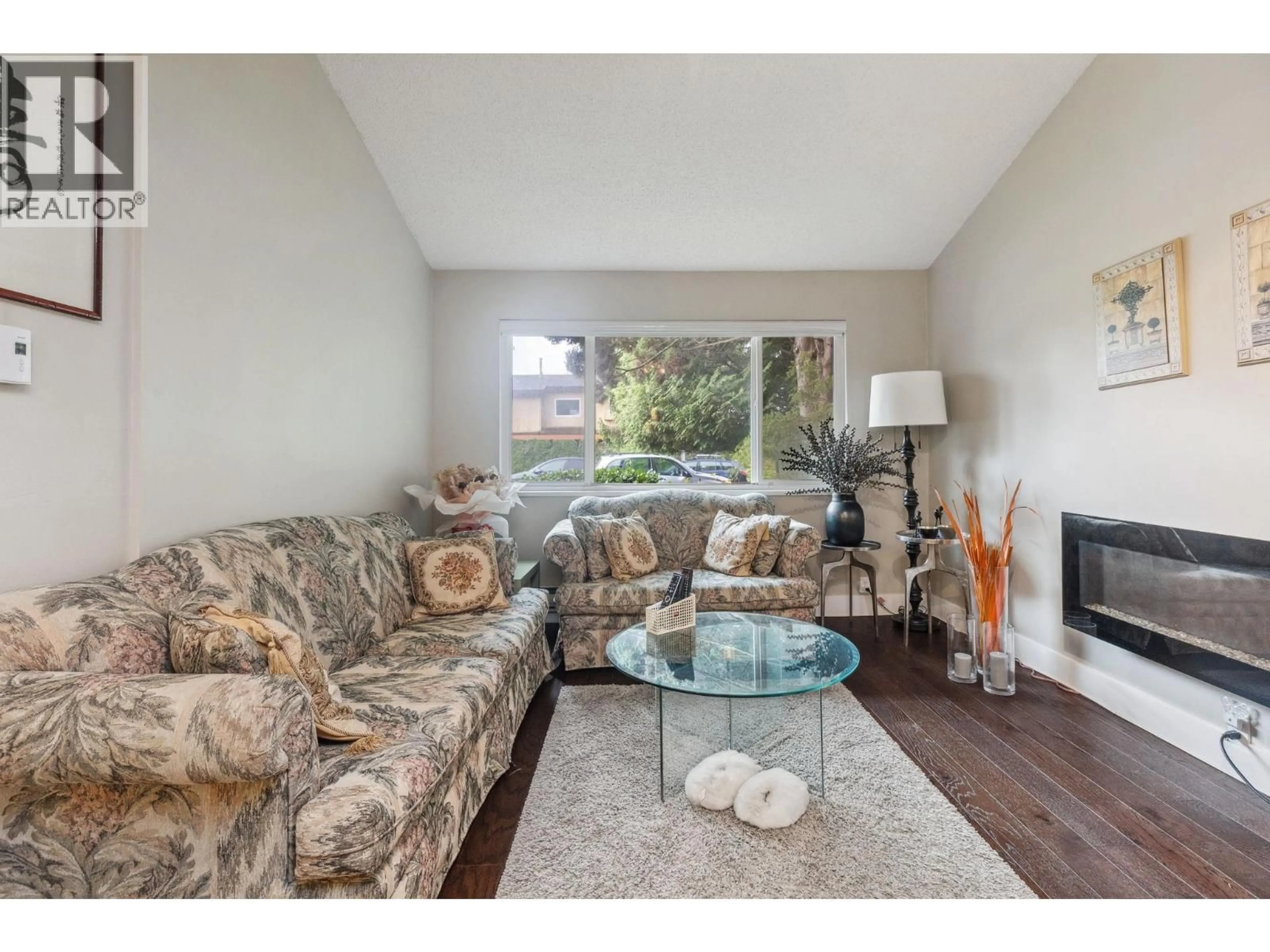 Living room with furniture, wood/laminate floor for 4231 CORLESS ROAD, Richmond British Columbia V7C1N1