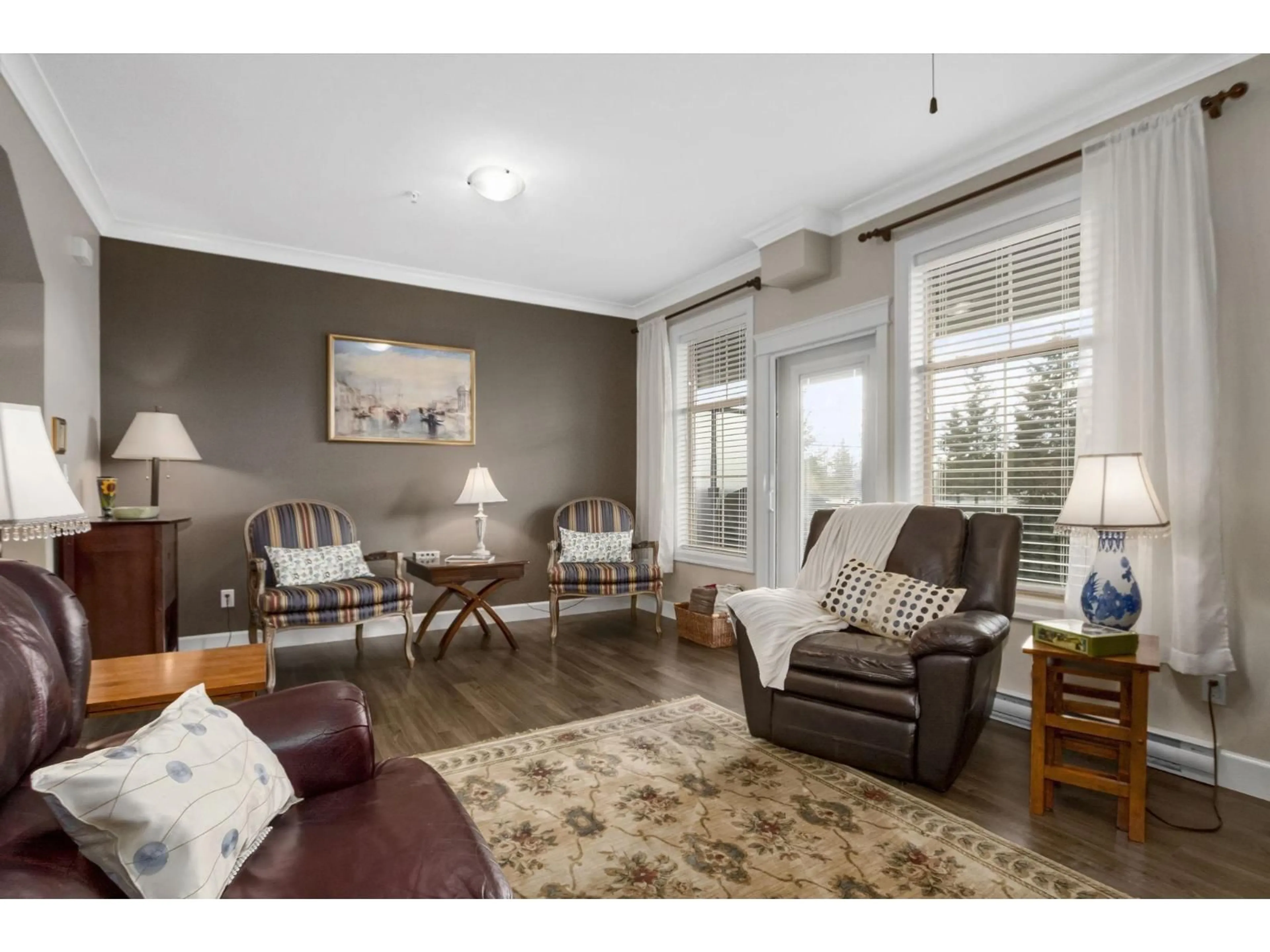 Living room with furniture, wood/laminate floor for 24 - 45025 WOLFE ROAD, Chilliwack British Columbia V2P7V9