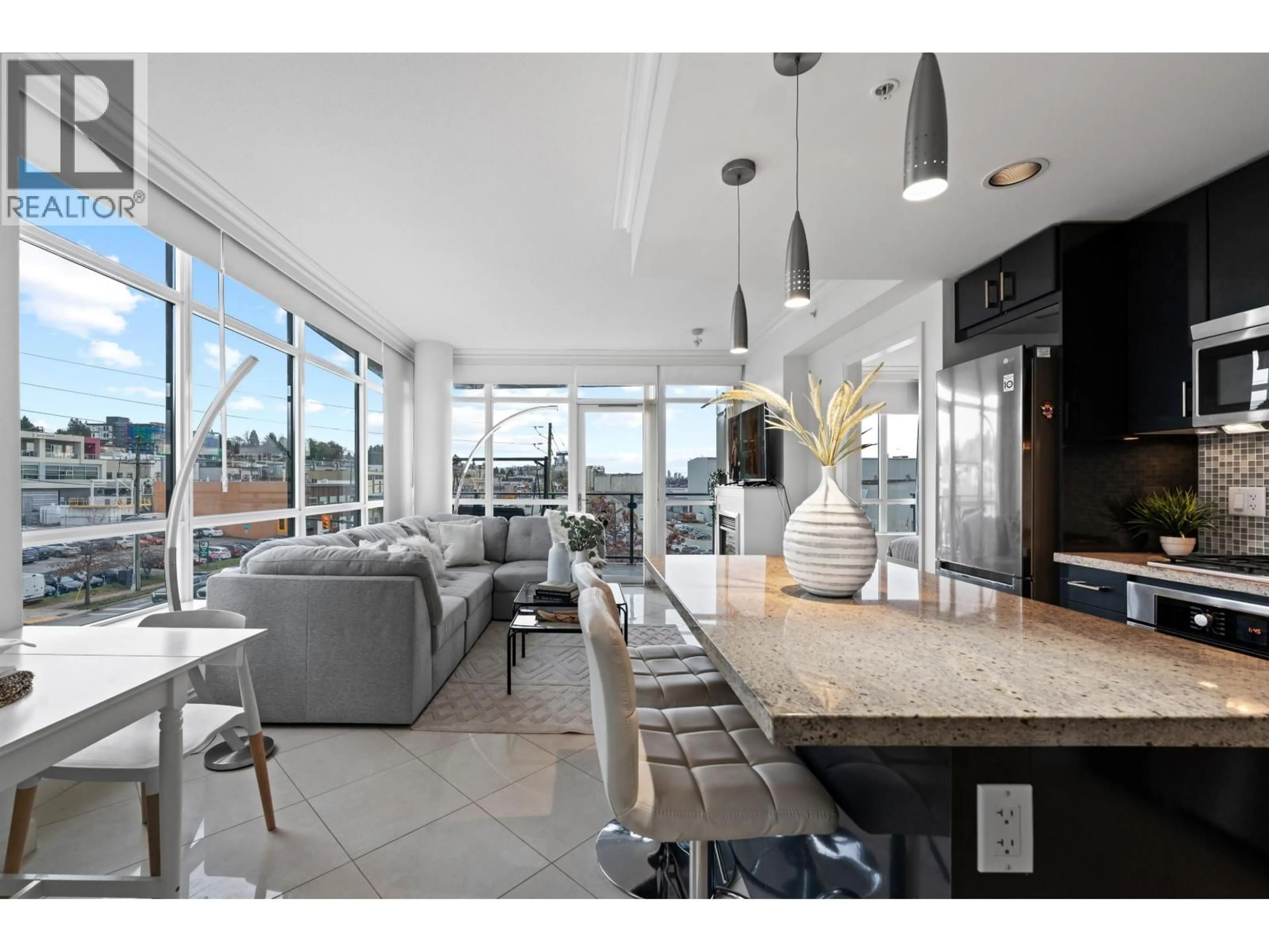 Open concept kitchen, ceramic/tile floor for 502 - 172 VICTORY SHIP WAY, North Vancouver British Columbia V7L0B5