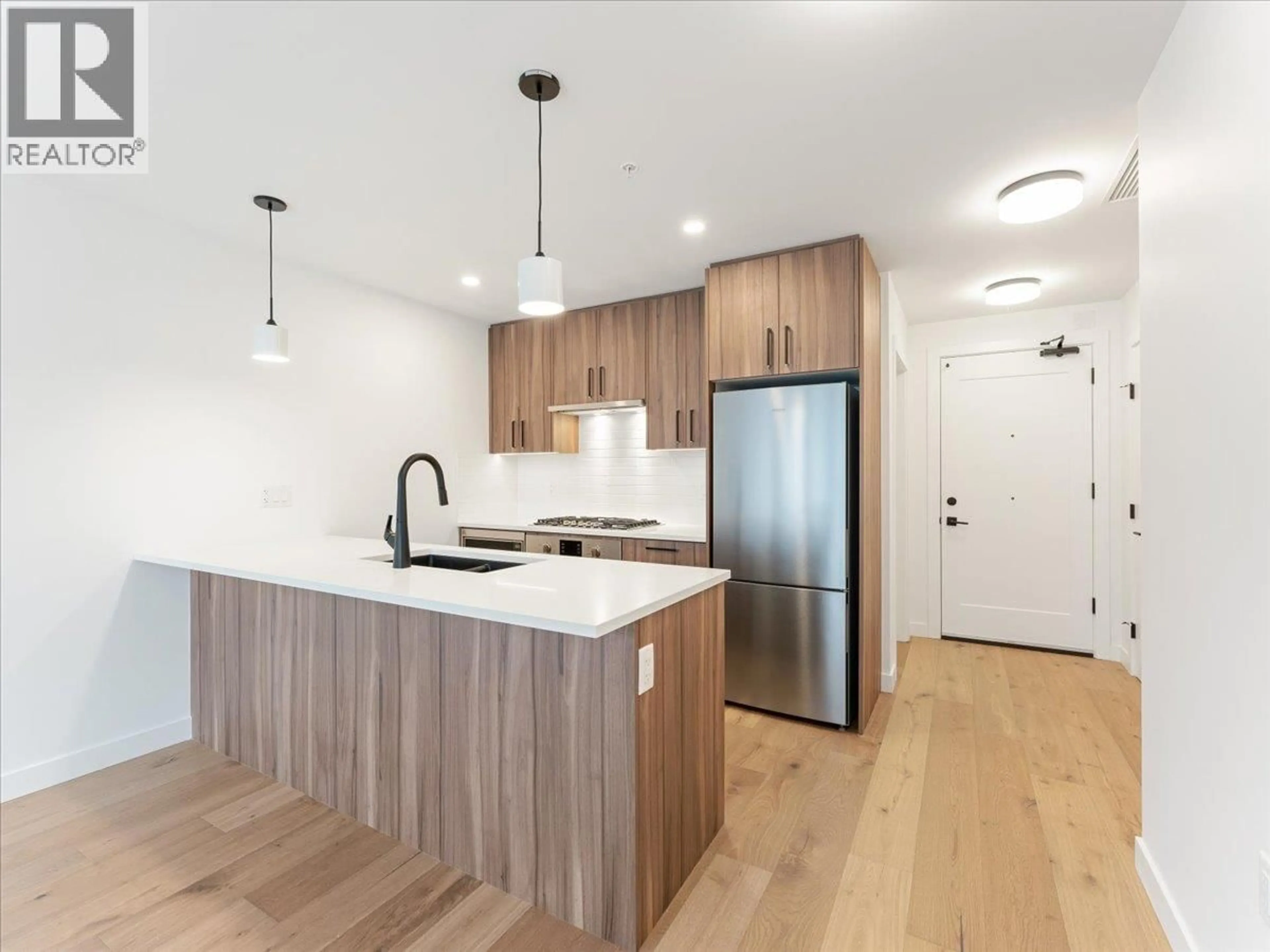 Open concept kitchen, wood/laminate floor for 201 - 6859 CAMBIE STREET, Vancouver British Columbia V6P0M4