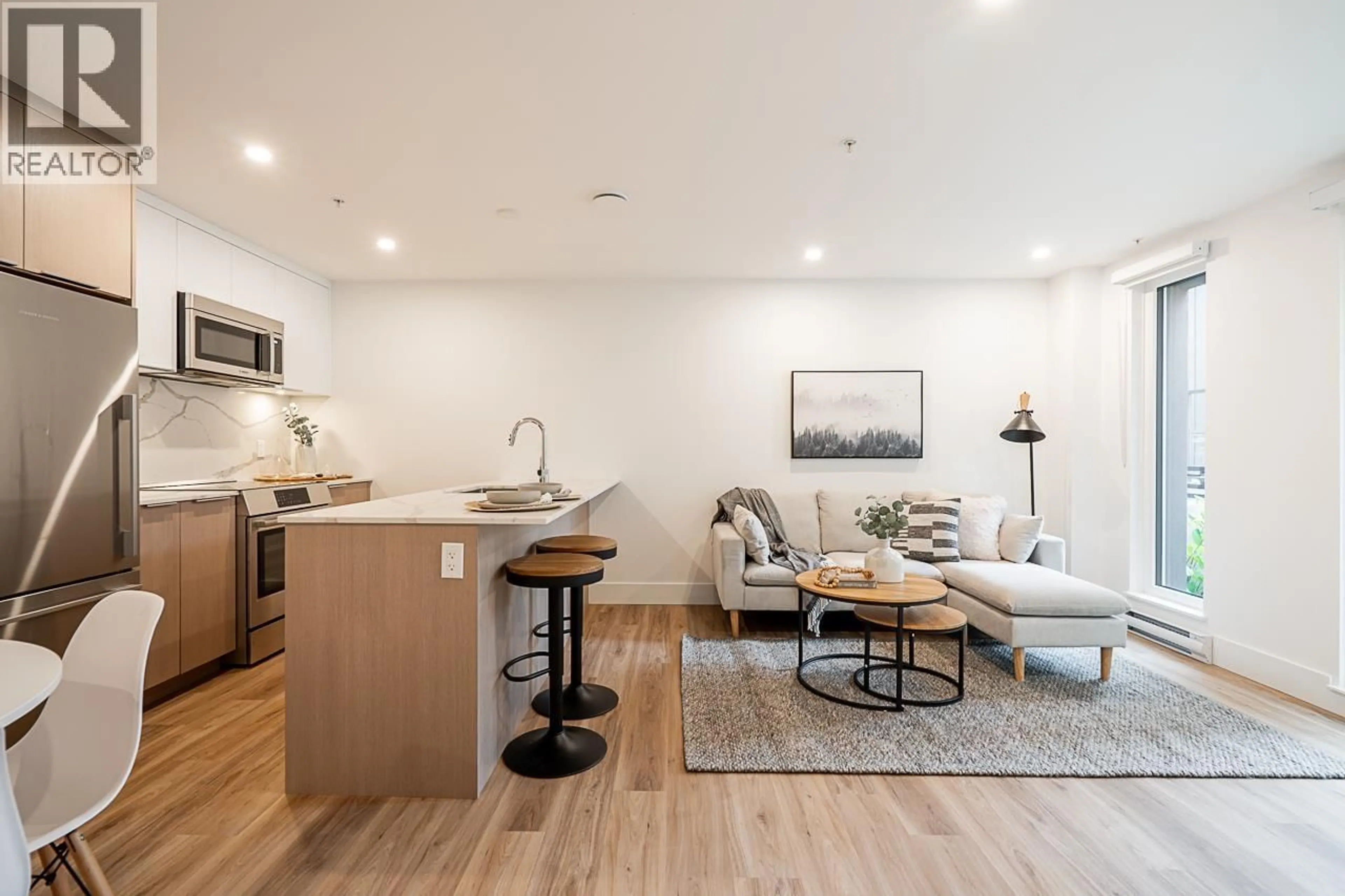 Open concept kitchen, wood/laminate floor for 110 - 2085 1ST AVENUE, Vancouver British Columbia V5N1B6