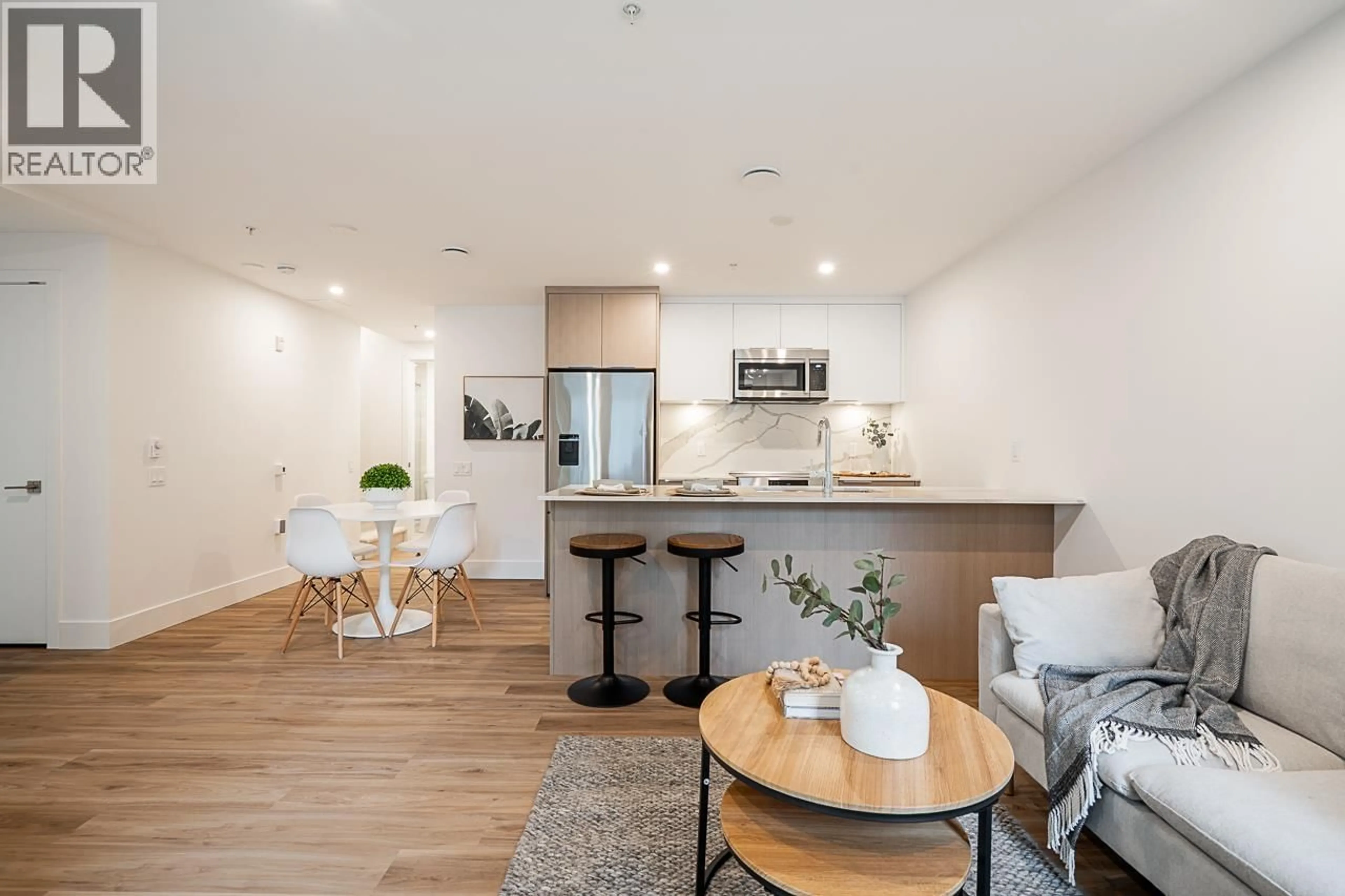 Open concept kitchen, wood/laminate floor for 110 - 2085 1ST AVENUE, Vancouver British Columbia V5N1B6