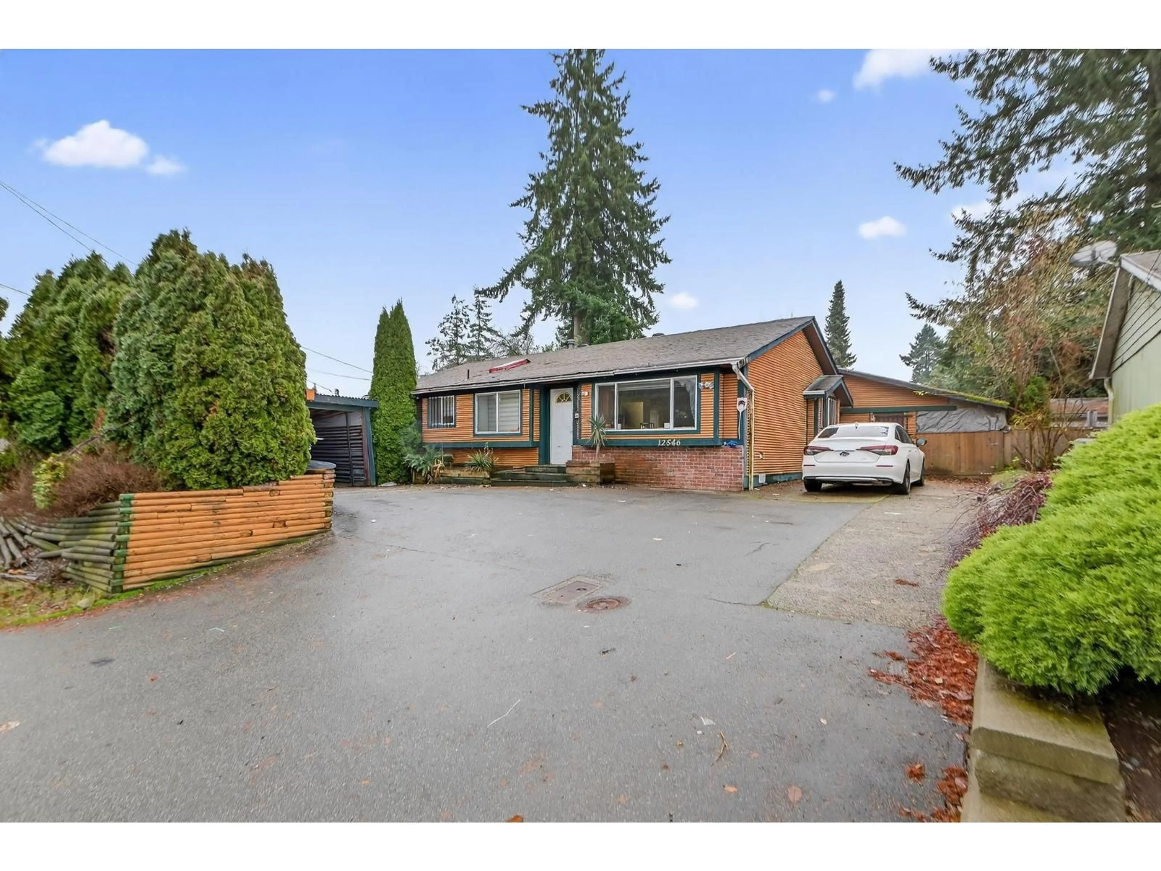 A pic from outside/outdoor area/front of a property/back of a property/a pic from drone, street for 12546 96 AVENUE, Surrey British Columbia V3V1X4