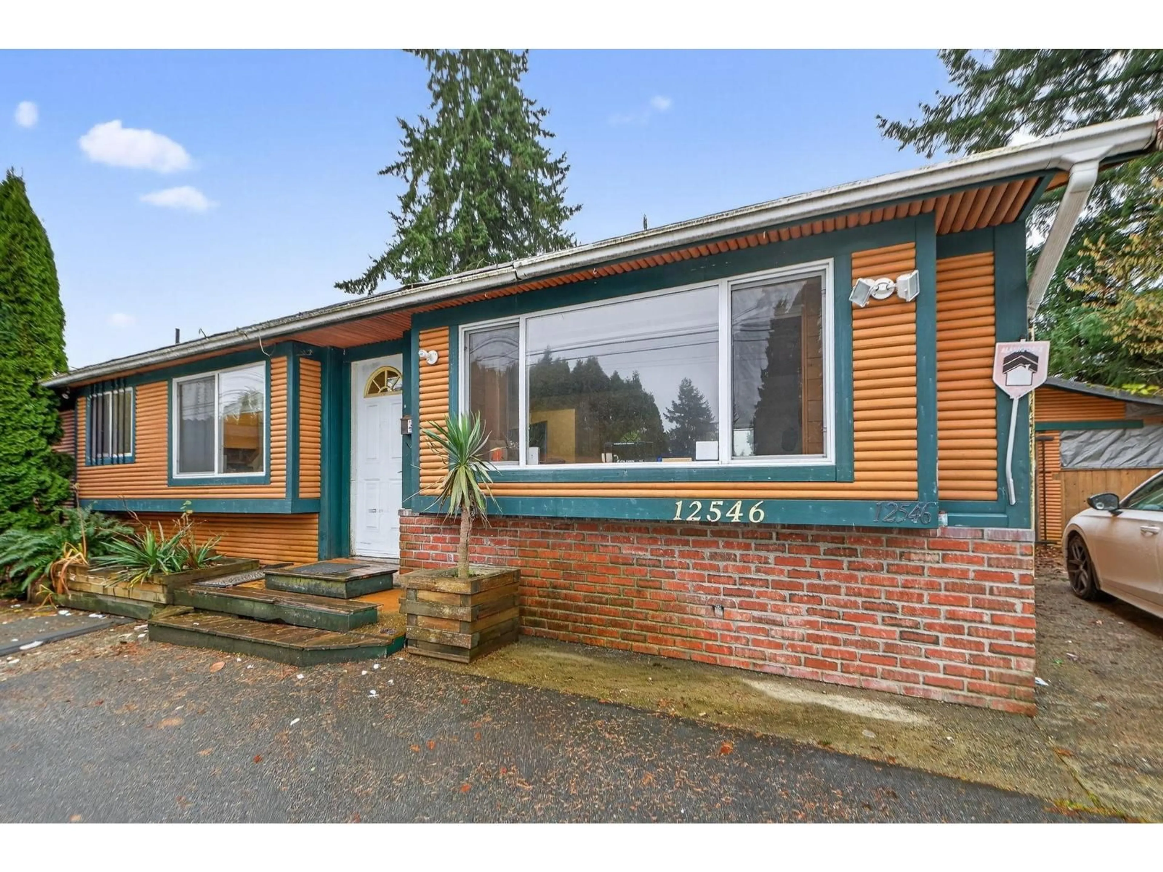 Home with brick exterior material, street for 12546 96 AVENUE, Surrey British Columbia V3V1X4