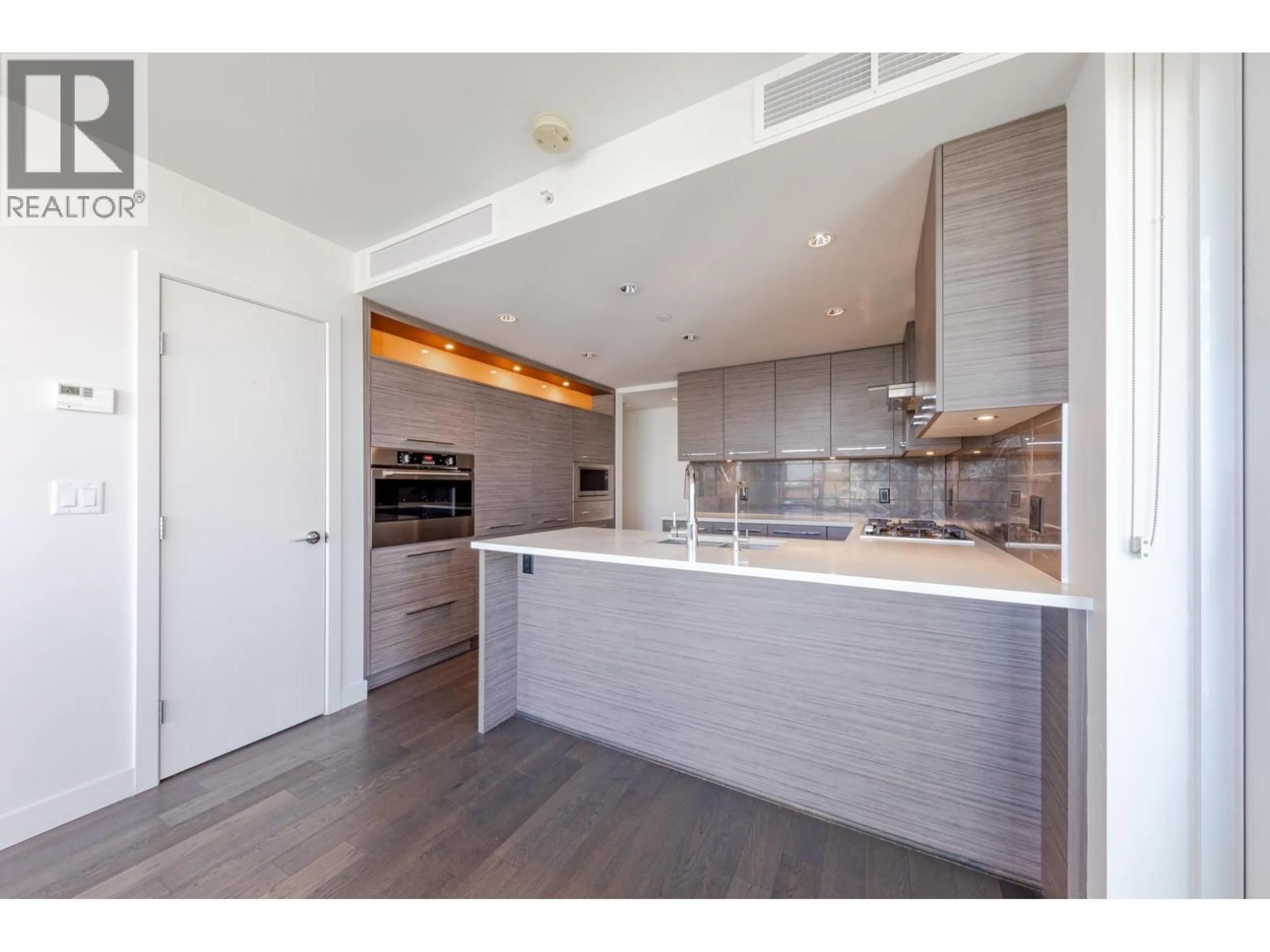 Open concept kitchen, wood/laminate floor for 902 - 7468 LANSDOWNE ROAD, Richmond British Columbia V7C0B7