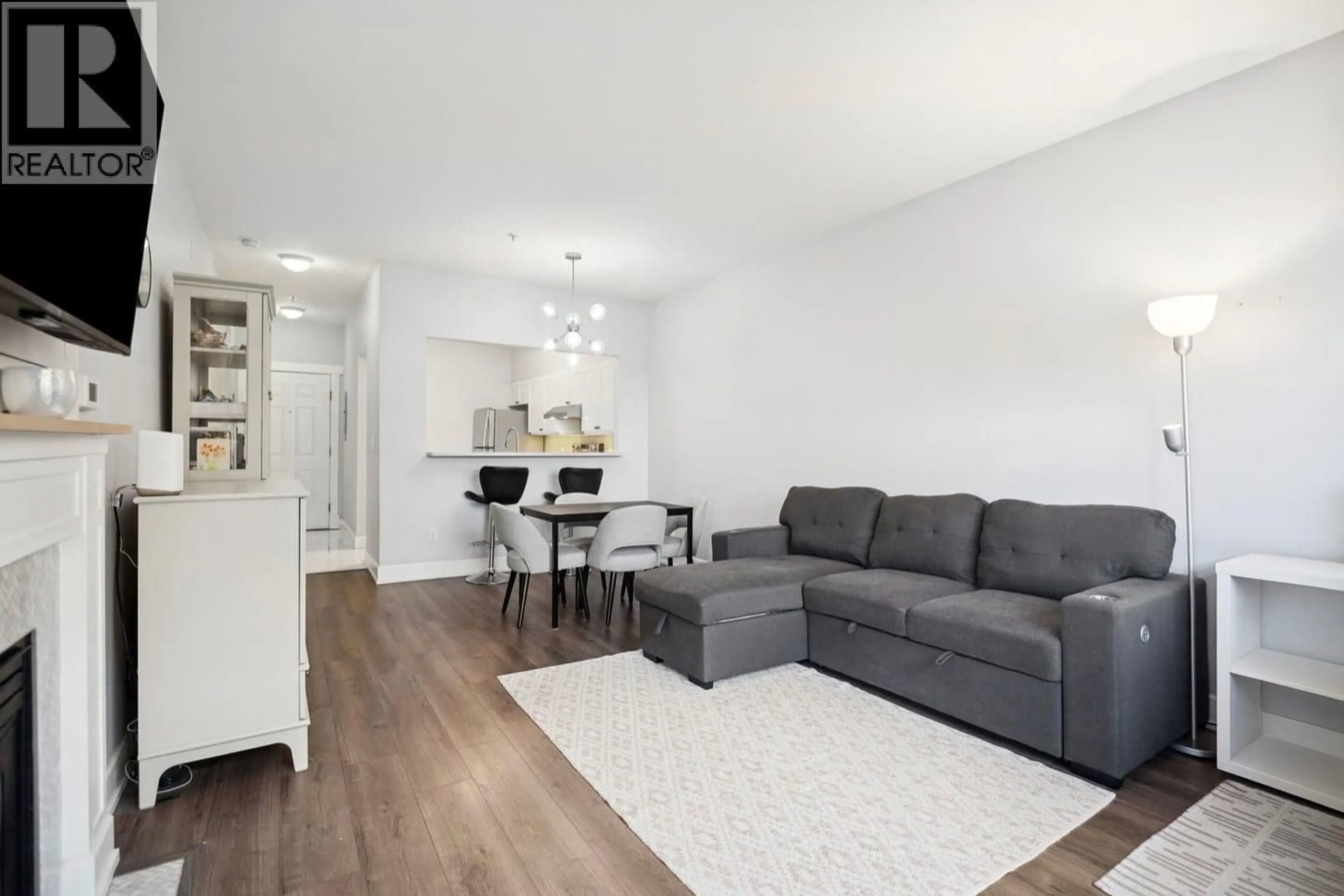 Living room with furniture, wood/laminate floor for 134 - 5888 DOVER CRESCENT, Richmond British Columbia V7C5R9