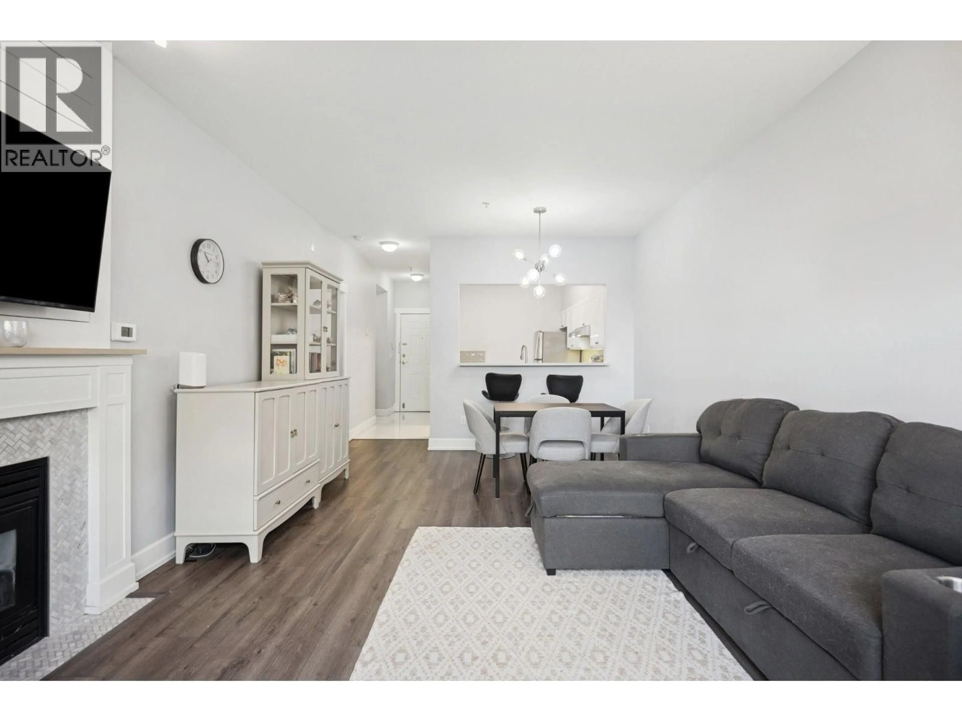 Living room with furniture, wood/laminate floor for 134 - 5888 DOVER CRESCENT, Richmond British Columbia V7C5R9