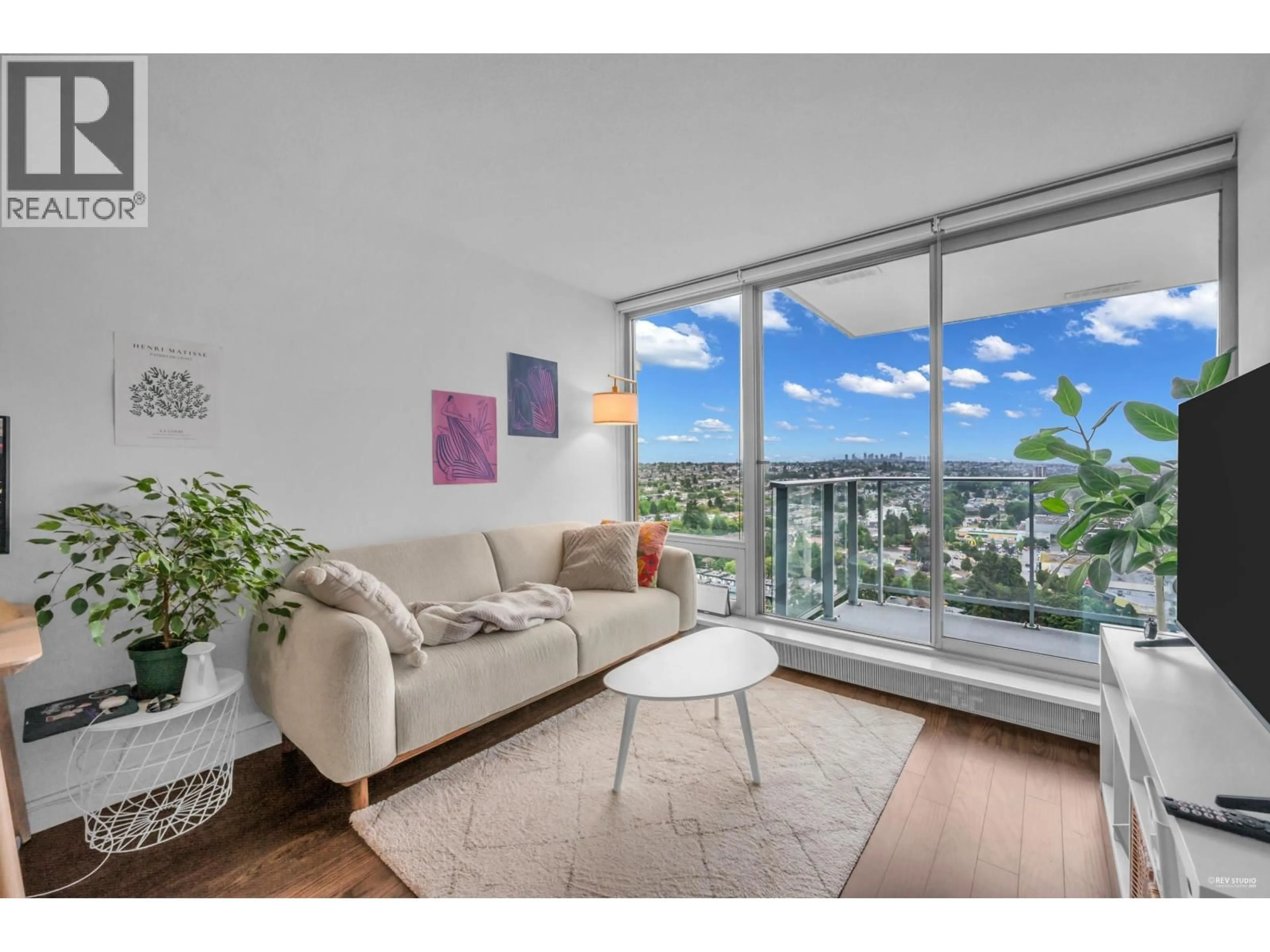 Living room with furniture, wood/laminate floor for 2205 - 8031 NUNAVUT LANE, Vancouver British Columbia V5X0C9