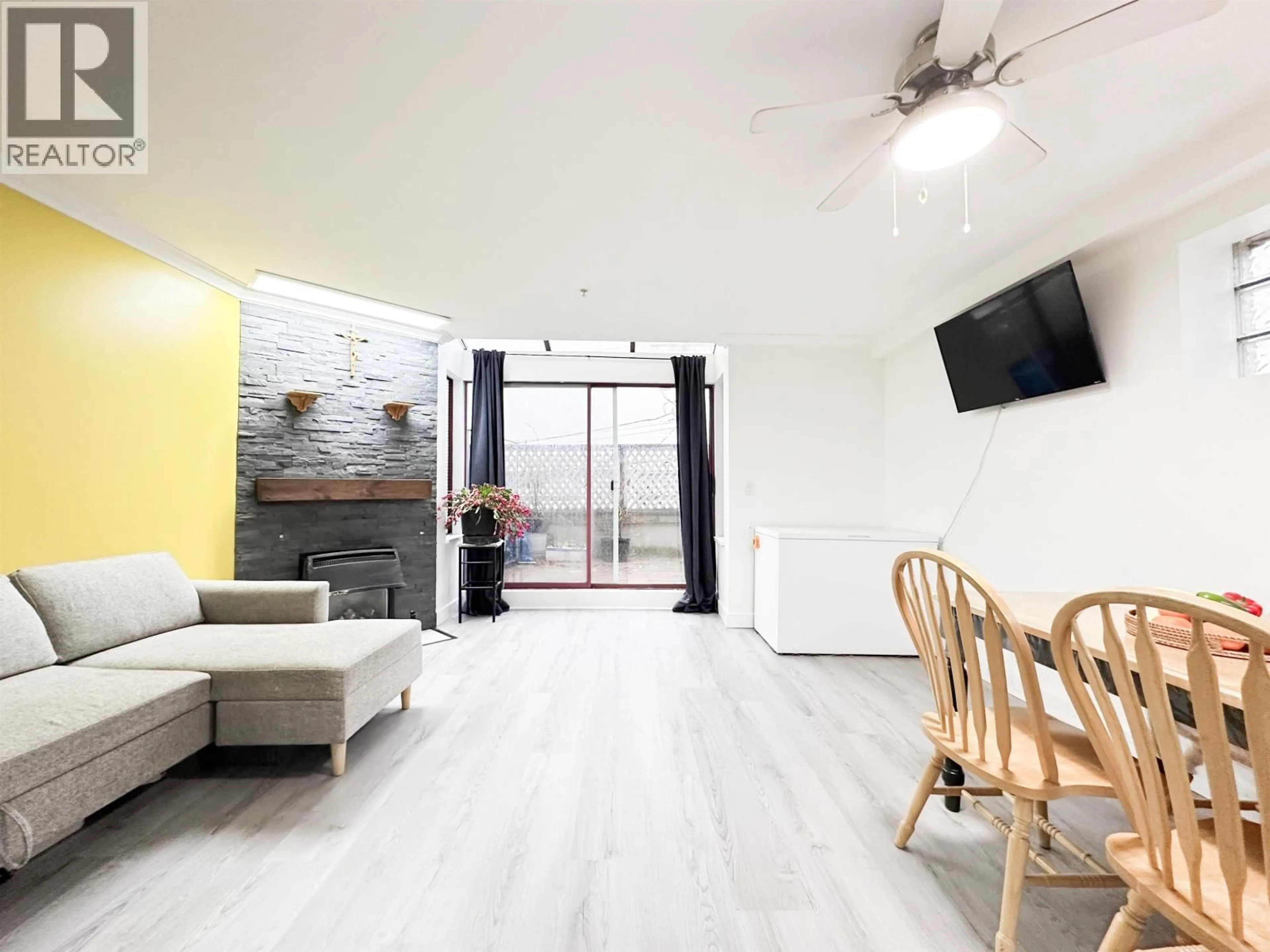 Living room with furniture, wood/laminate floor for 211 - 22356 MCINTOSH AVENUE, Maple Ridge British Columbia V2X3C1