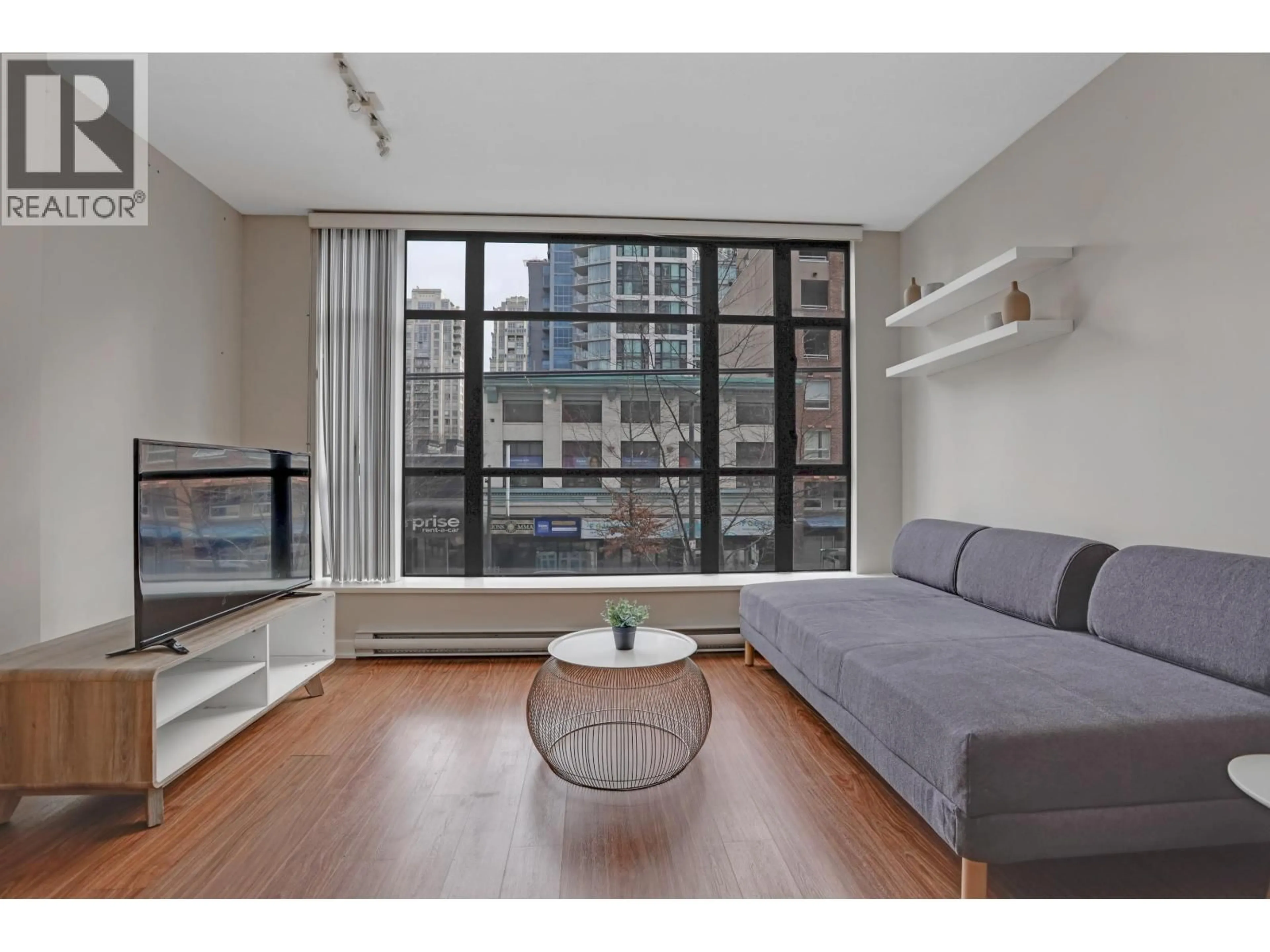 Living room with furniture, unknown for 209 - 1249 GRANVILLE STREET, Vancouver British Columbia V6Z1M5