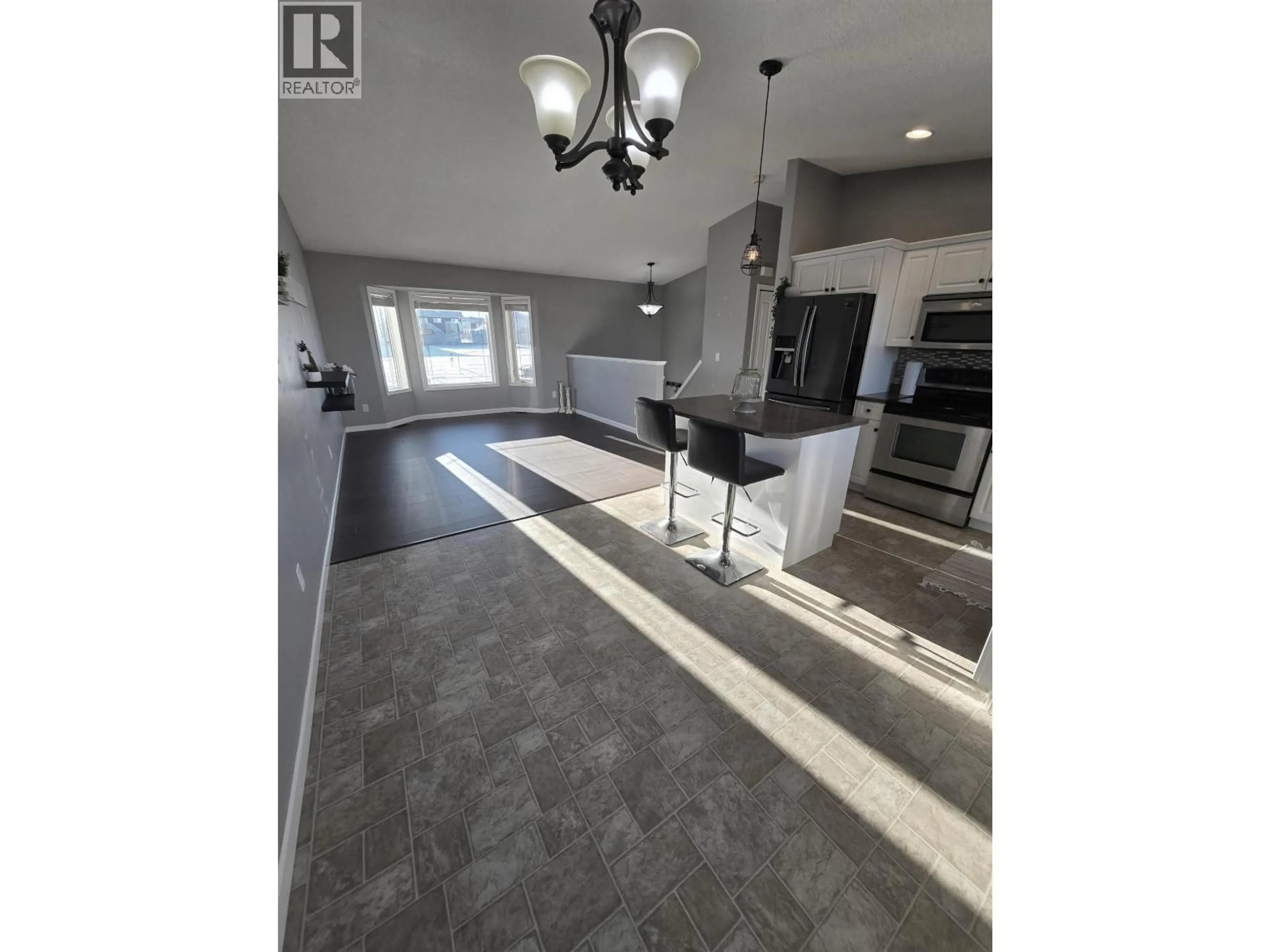 Open concept kitchen, ceramic/tile floor for 8724 114 AVENUE, Fort St. John British Columbia V1J0C3
