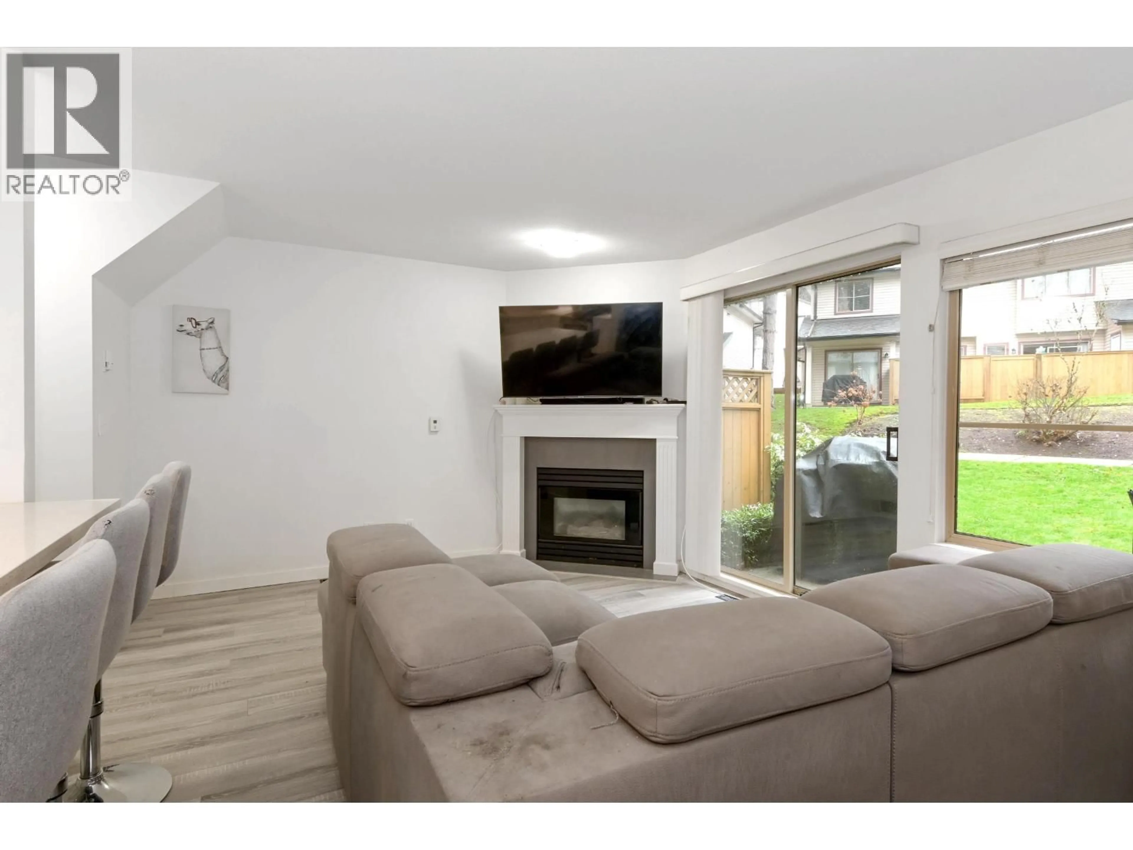 Living room with furniture, wood/laminate floor for 34 - 21960 RIVER ROAD, Maple Ridge British Columbia V2X2C3