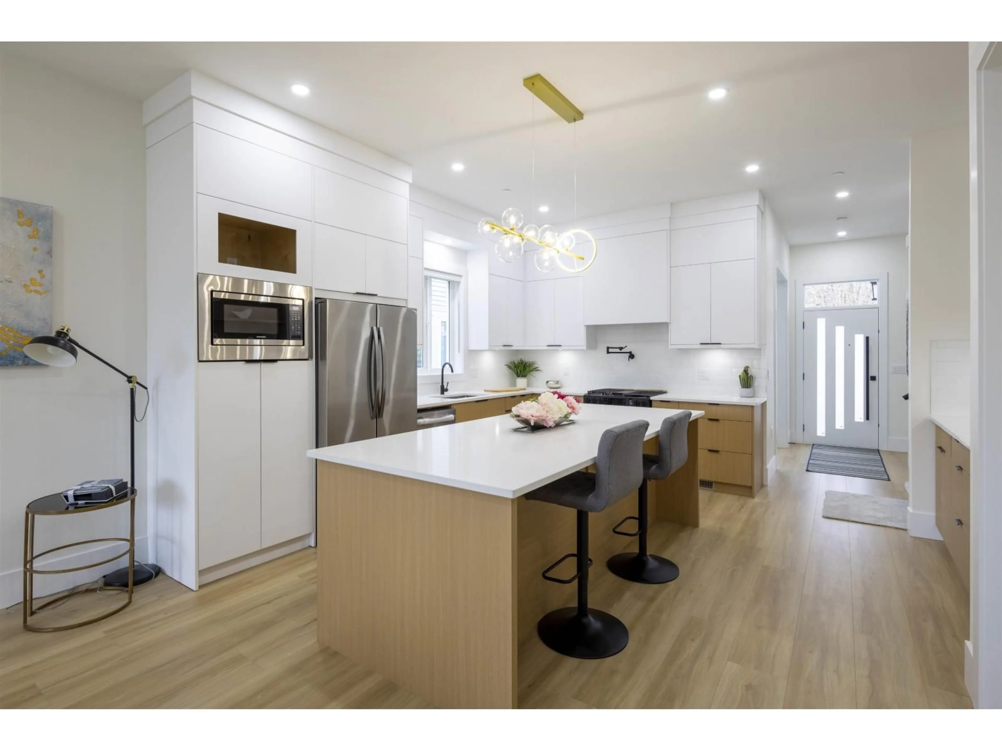 Open concept kitchen, wood/laminate floor for 7683 197 STREET, Langley British Columbia V2Y3T4