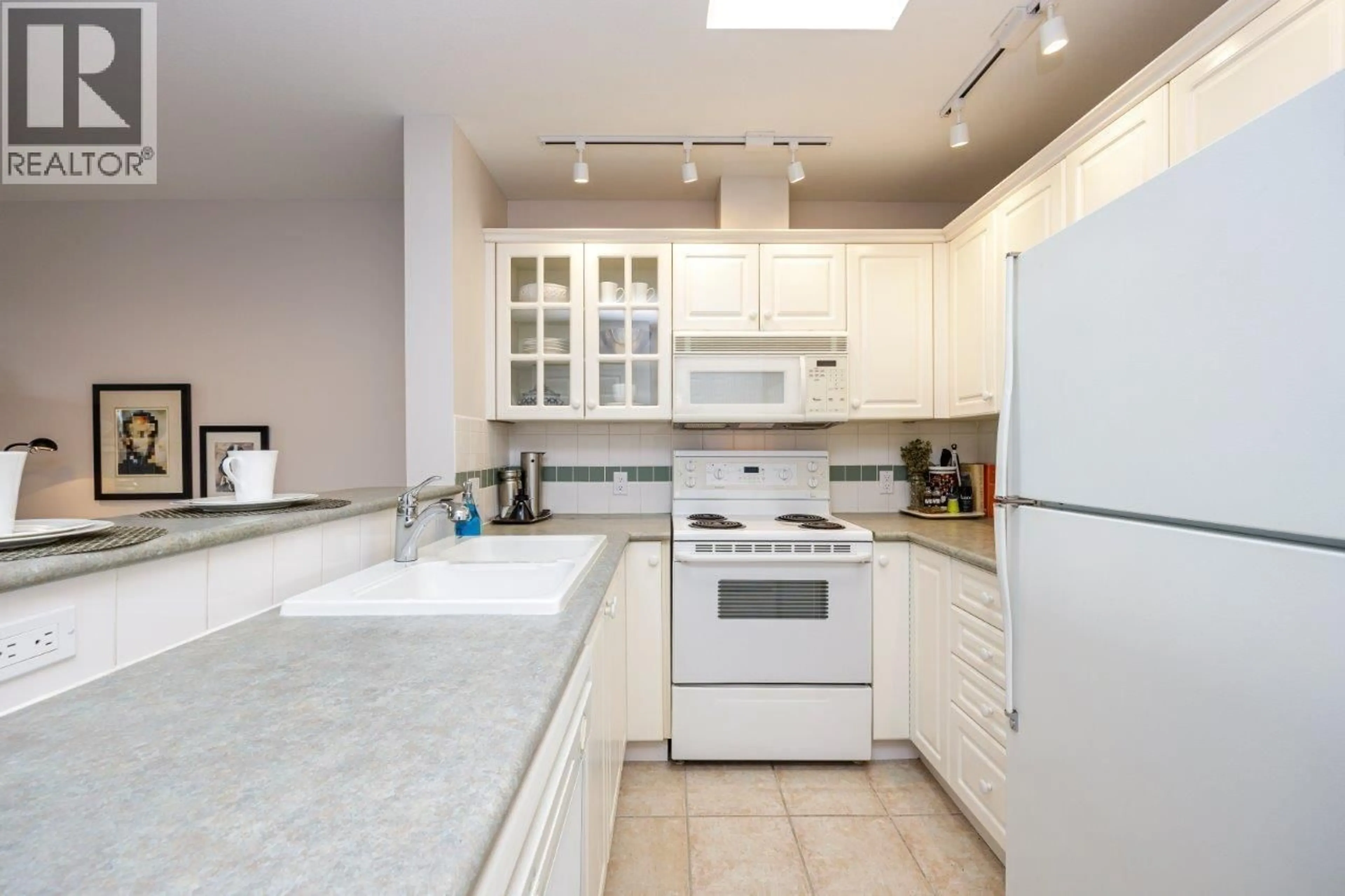 Standard kitchen, ceramic/tile floor for 410 - 155 3RD STREET, North Vancouver British Columbia V7L1E5