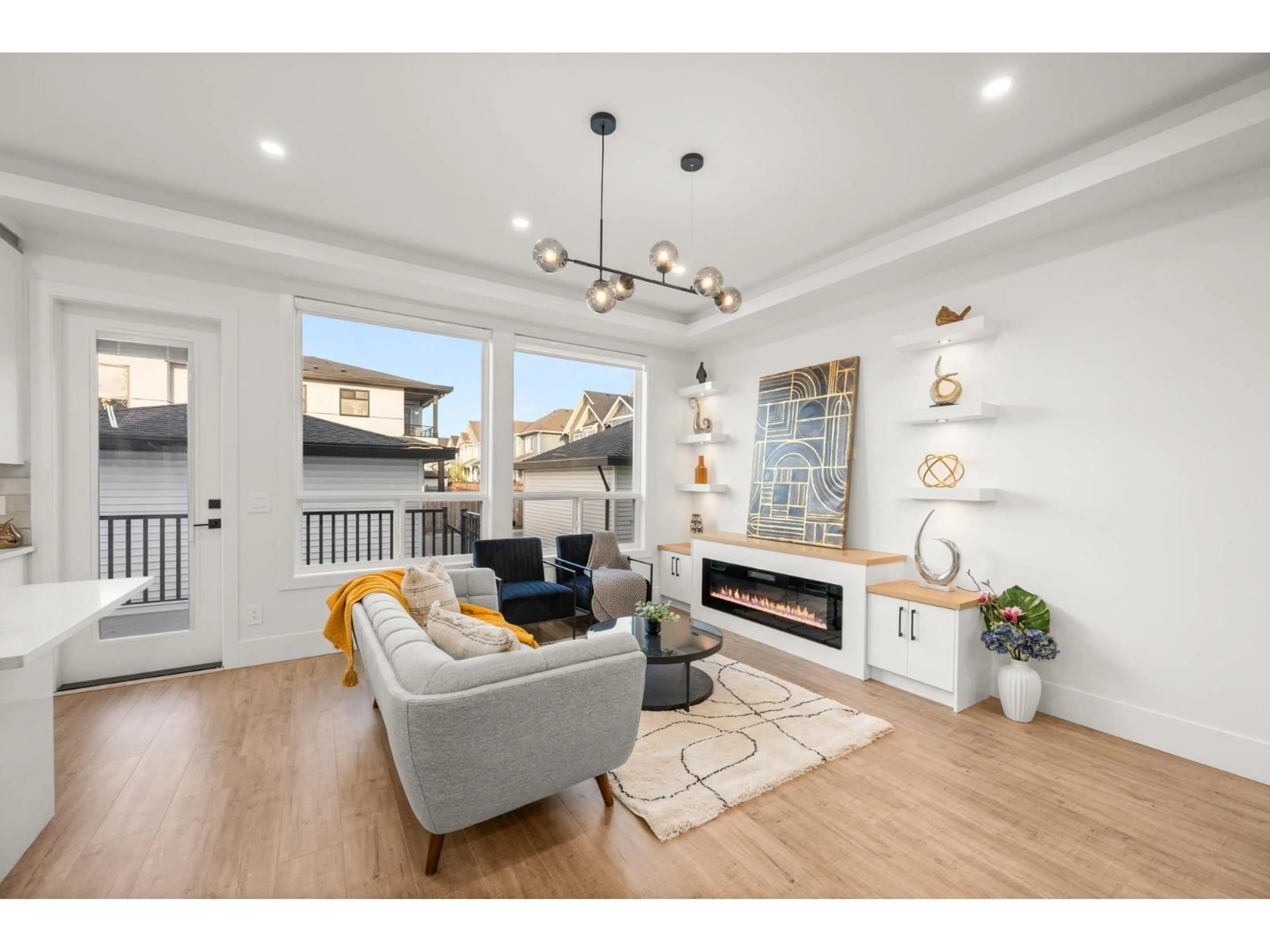 Living room with furniture, wood/laminate floor for 7652 206 STREET, Langley British Columbia V2Y3P6