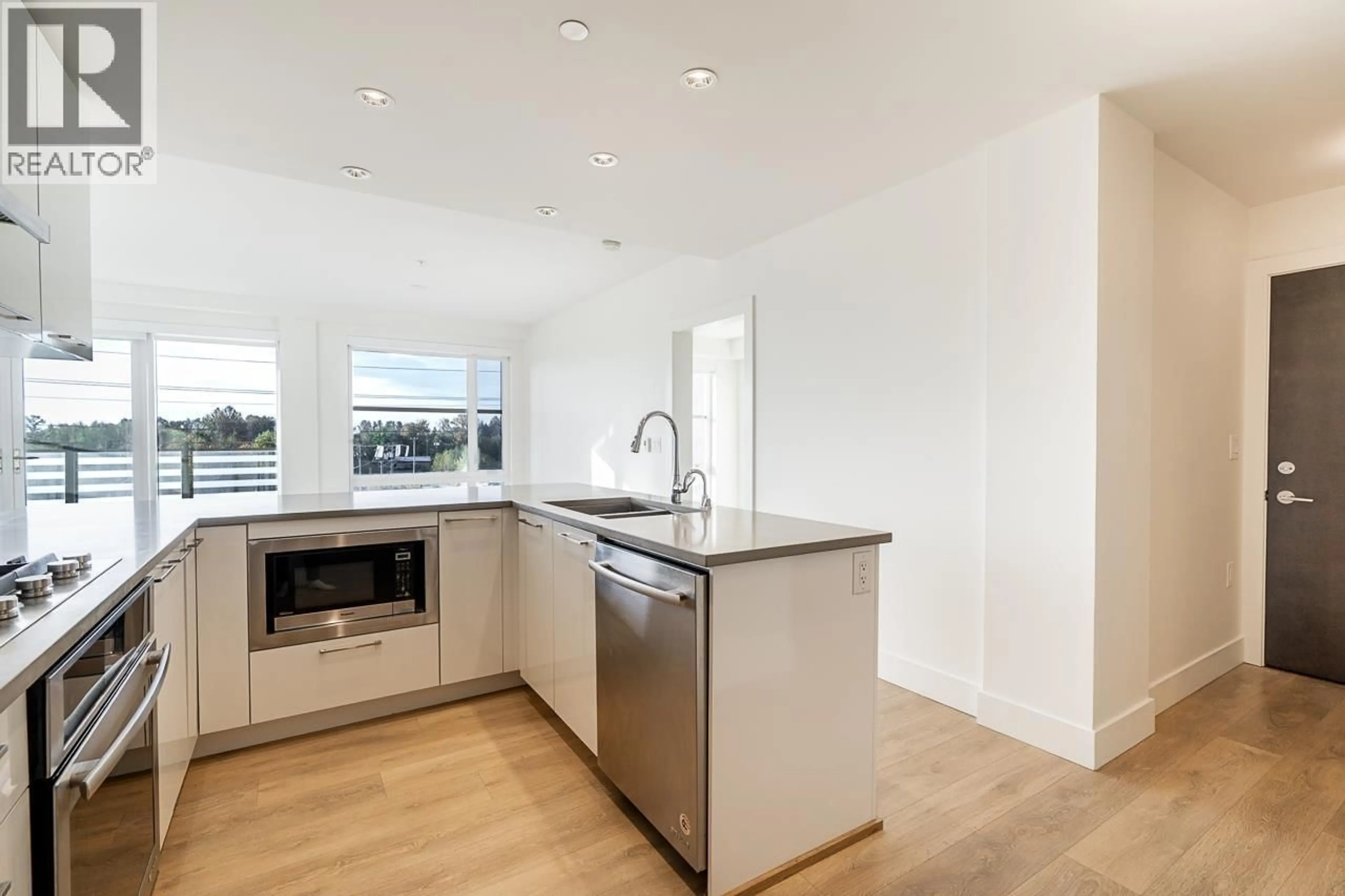 Open concept kitchen, unknown for 515 - 3488 SAWMILL CRESCENT, Vancouver British Columbia V5S0C7