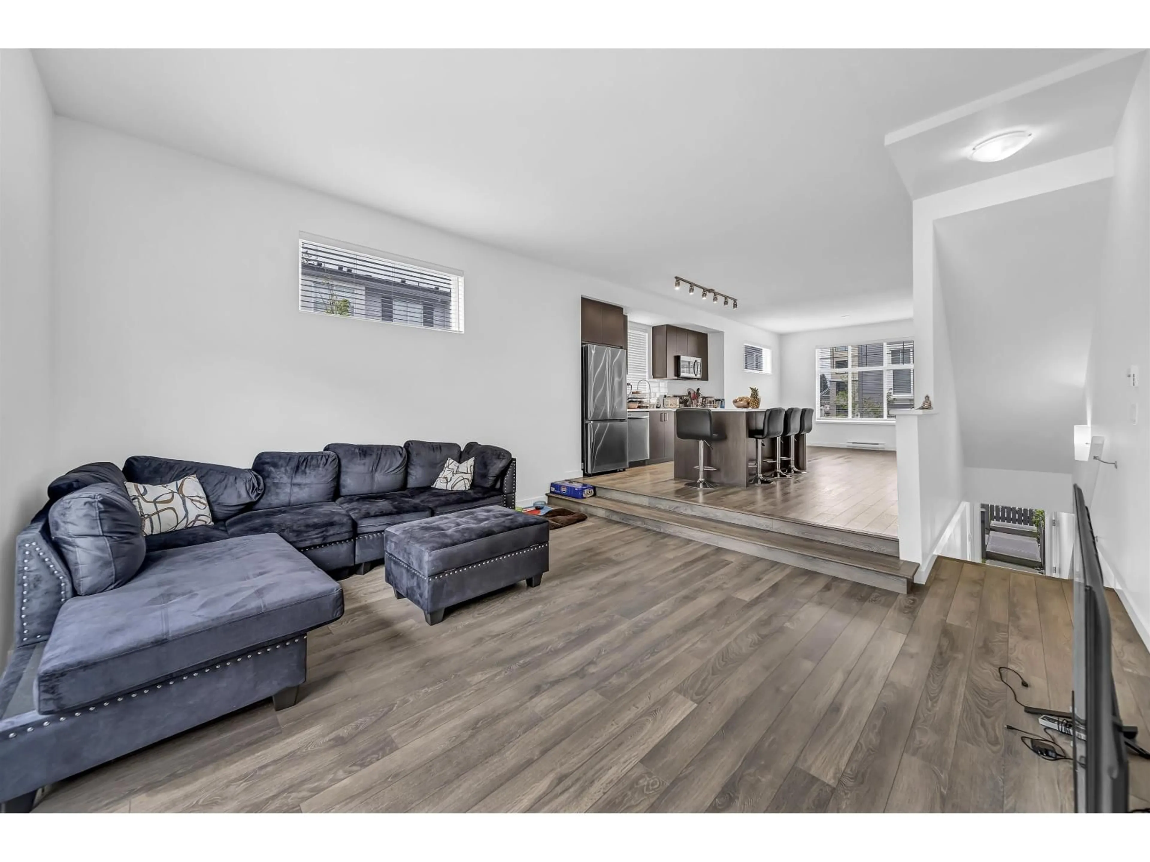 Living room with furniture, wood/laminate floor for 120 - 15778 85 AVENUE, Surrey British Columbia V4N6W8