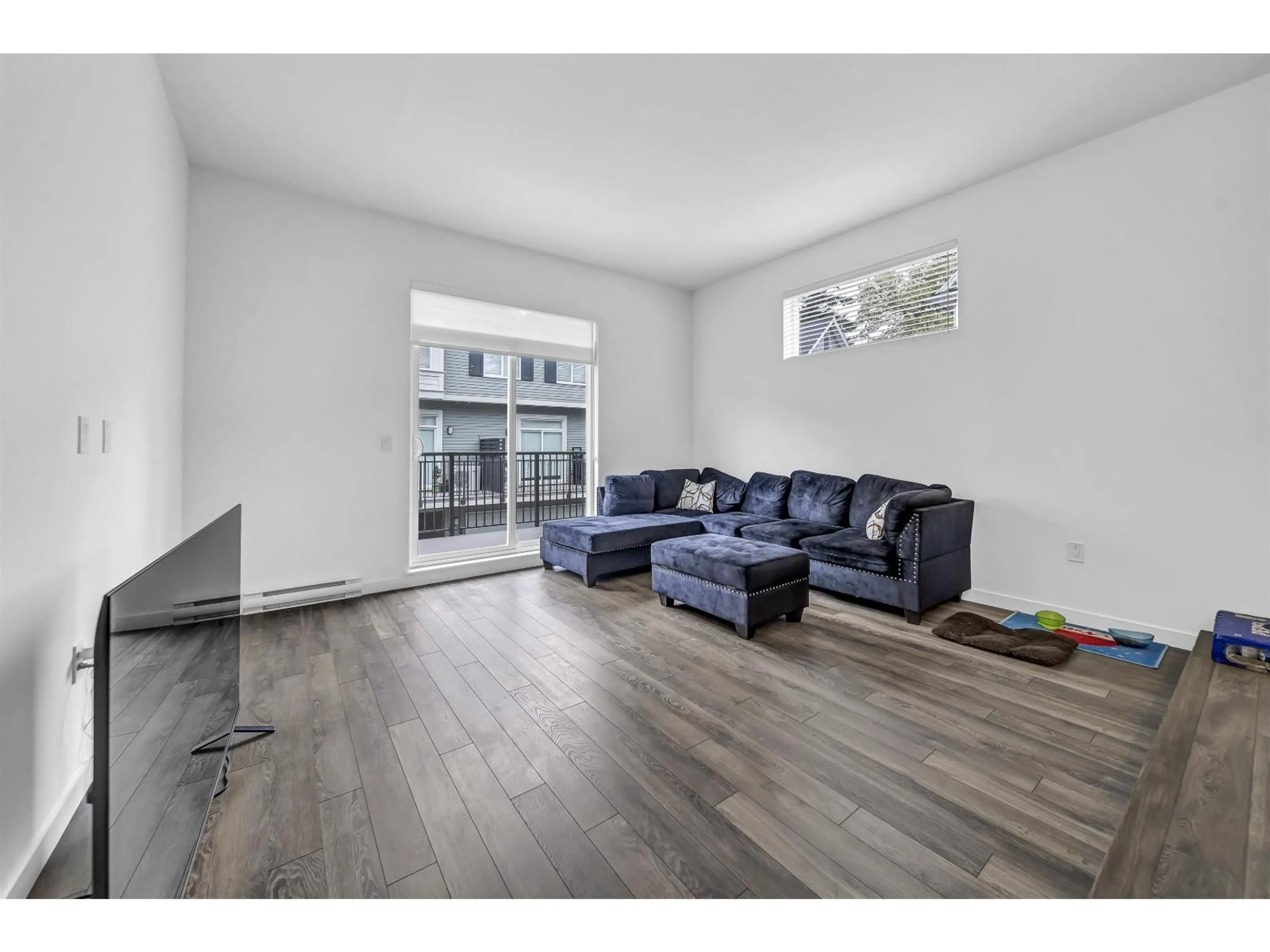 Living room with furniture, wood/laminate floor for 120 - 15778 85 AVENUE, Surrey British Columbia V4N6W8
