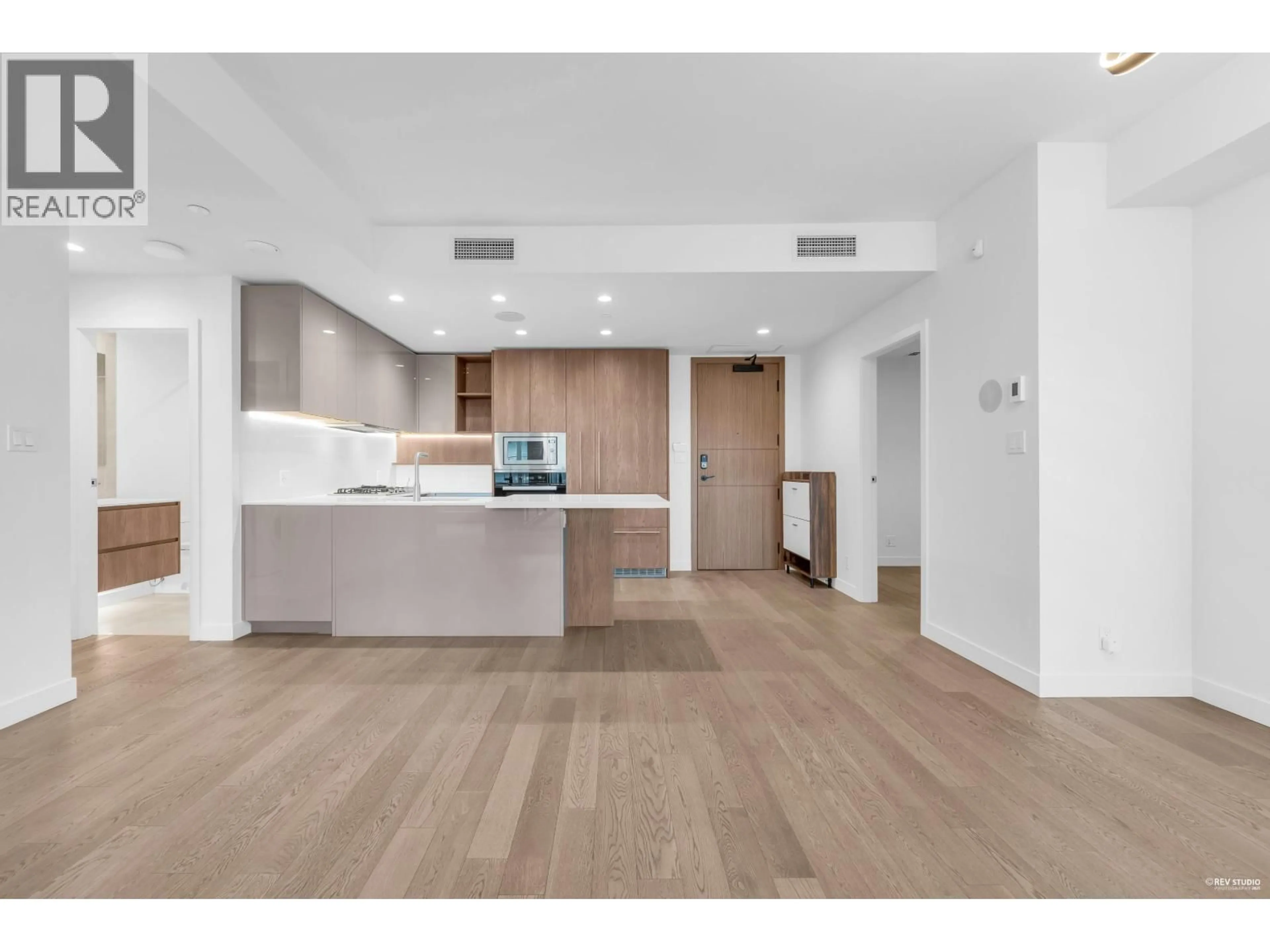 Open concept kitchen, wood/laminate floor for 313 - 6811 PEARSON WAY, Richmond British Columbia V7C0E7