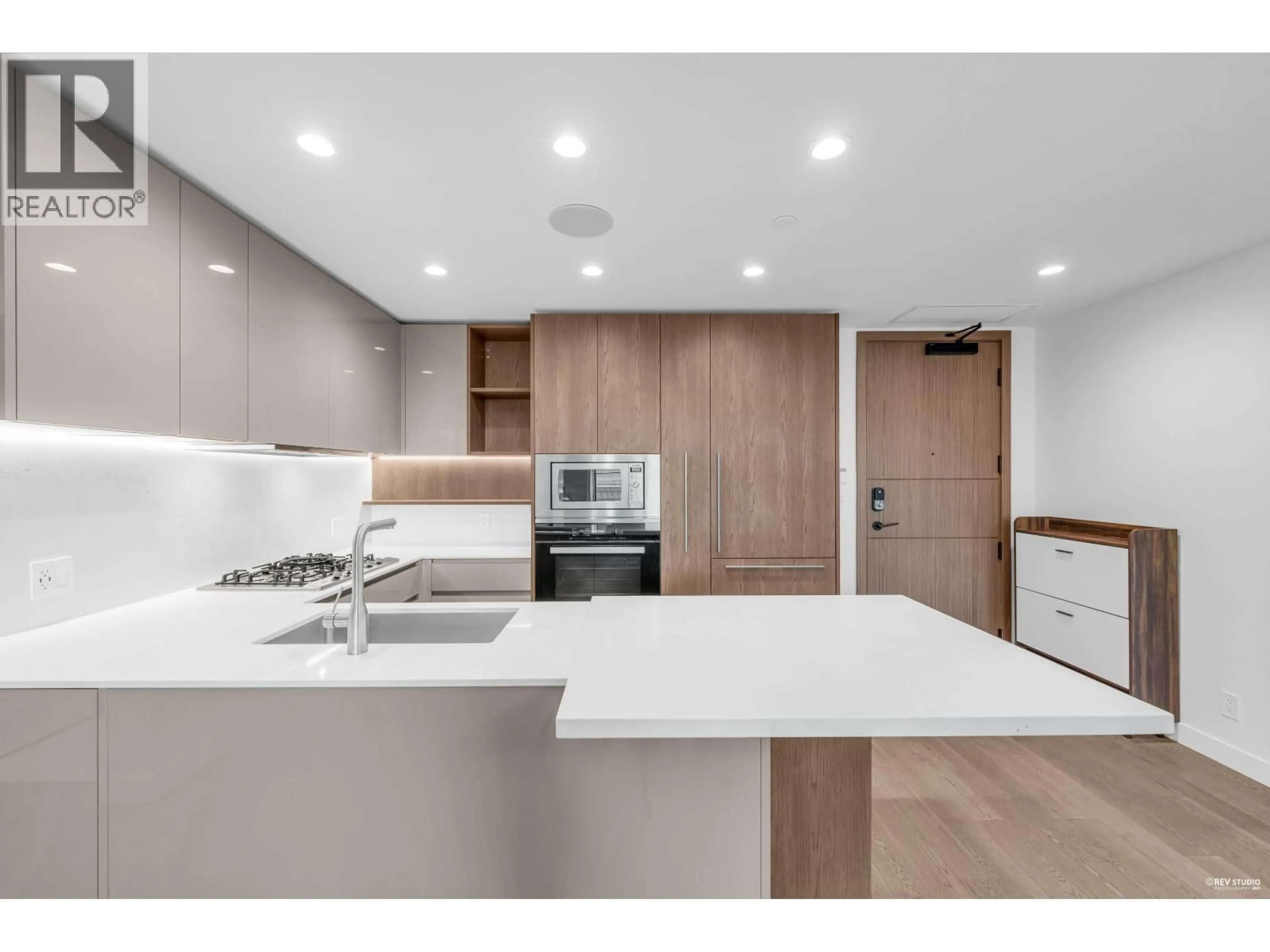 Open concept kitchen, wood/laminate floor for 313 - 6811 PEARSON WAY, Richmond British Columbia V7C0E7