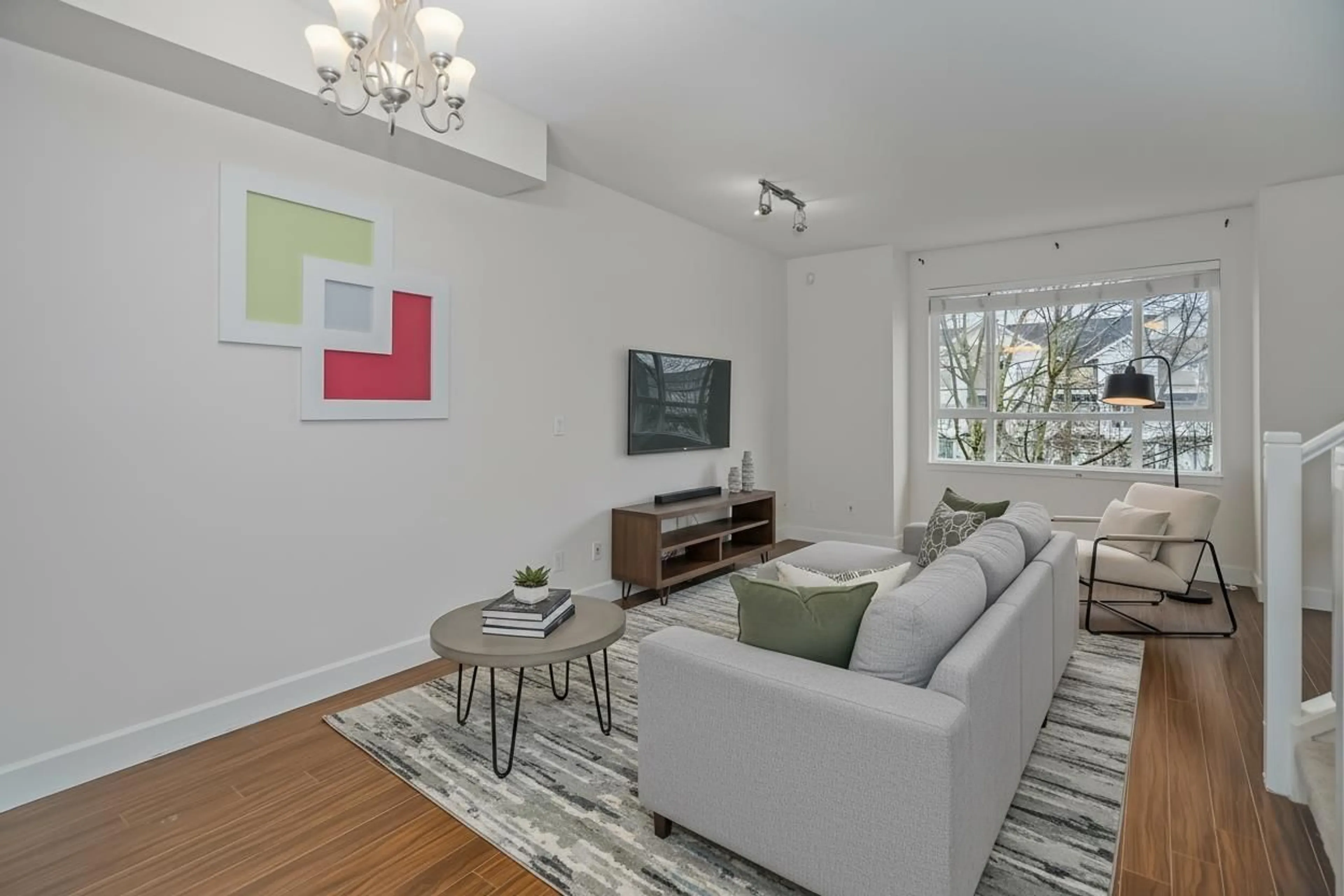 Living room with furniture, wood/laminate floor for 58 - 7088 191 STREET, Surrey British Columbia V4N0B4