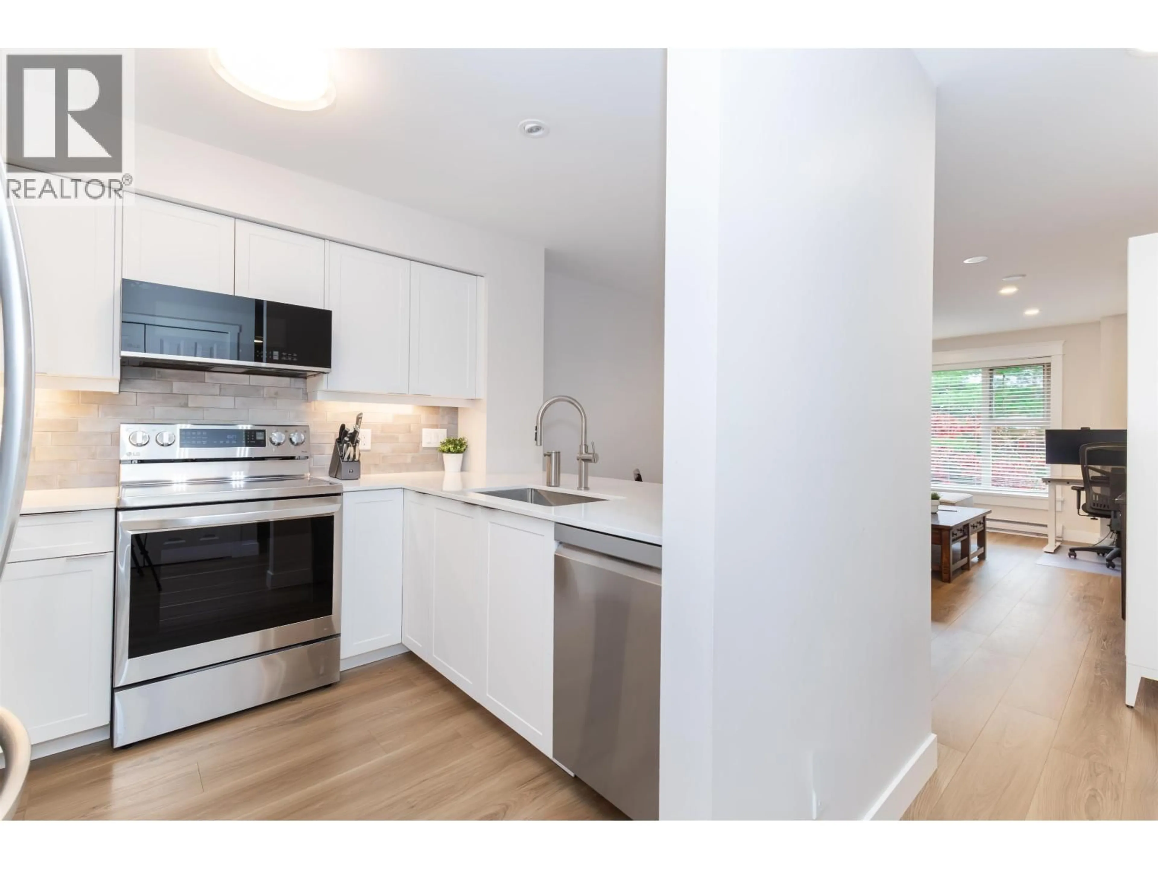 Open concept kitchen, wood/laminate floor for 210 - 808 SANGSTER PLACE, New Westminster British Columbia V3L5W3