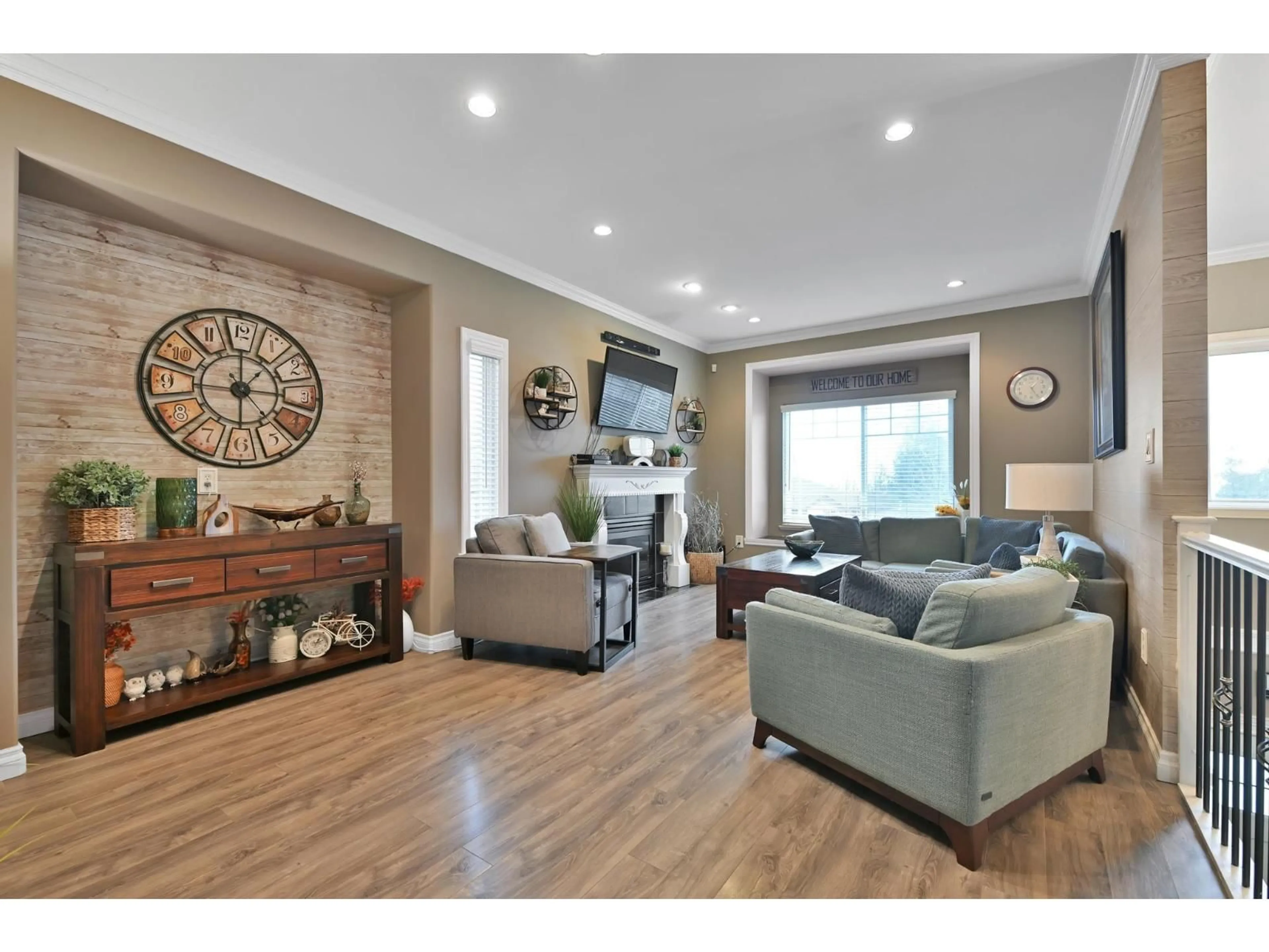 Living room with furniture, wood/laminate floor for 8021 MELBURN DRIVE, Mission British Columbia V2V7B6