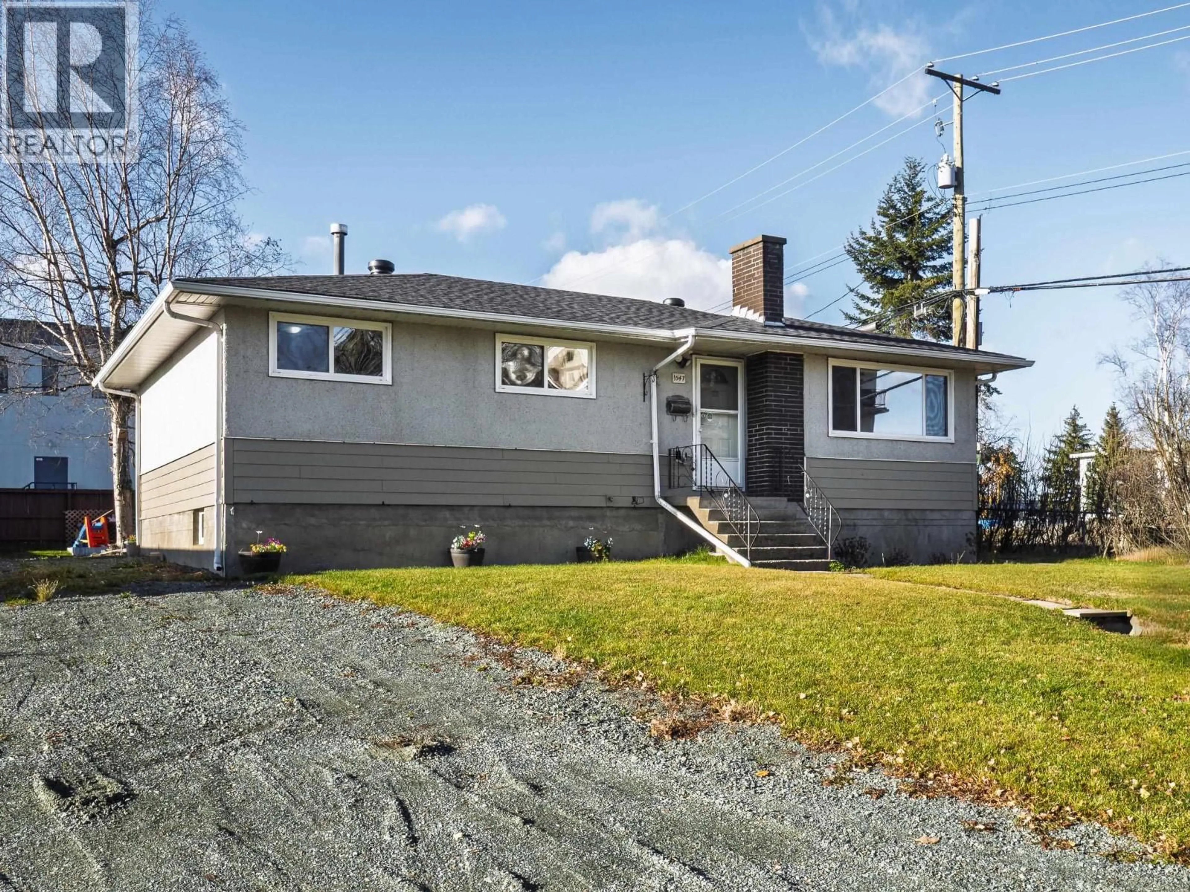 Home with vinyl exterior material, street for 1547 IRWIN STREET, Prince George British Columbia V2M2Y6