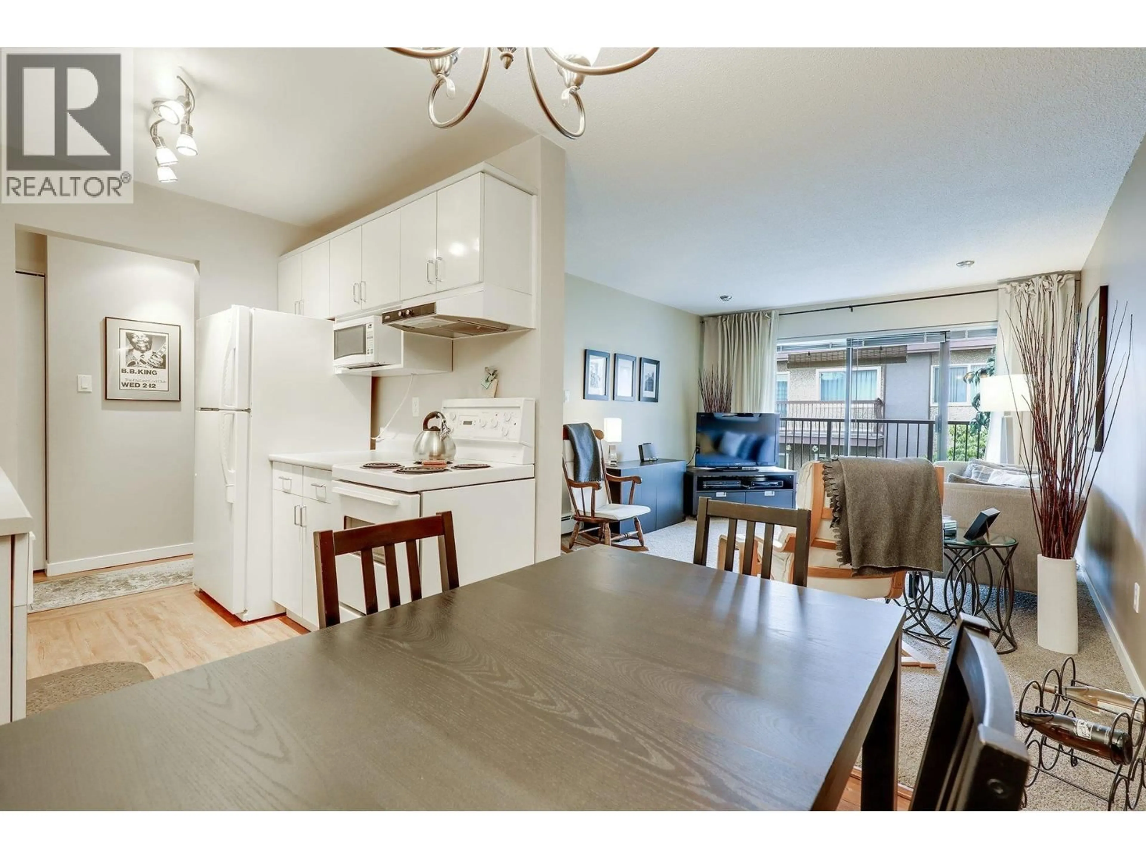 Open concept kitchen, wood/laminate floor for 302 - 330 1ST STREET, North Vancouver British Columbia V7L1B5