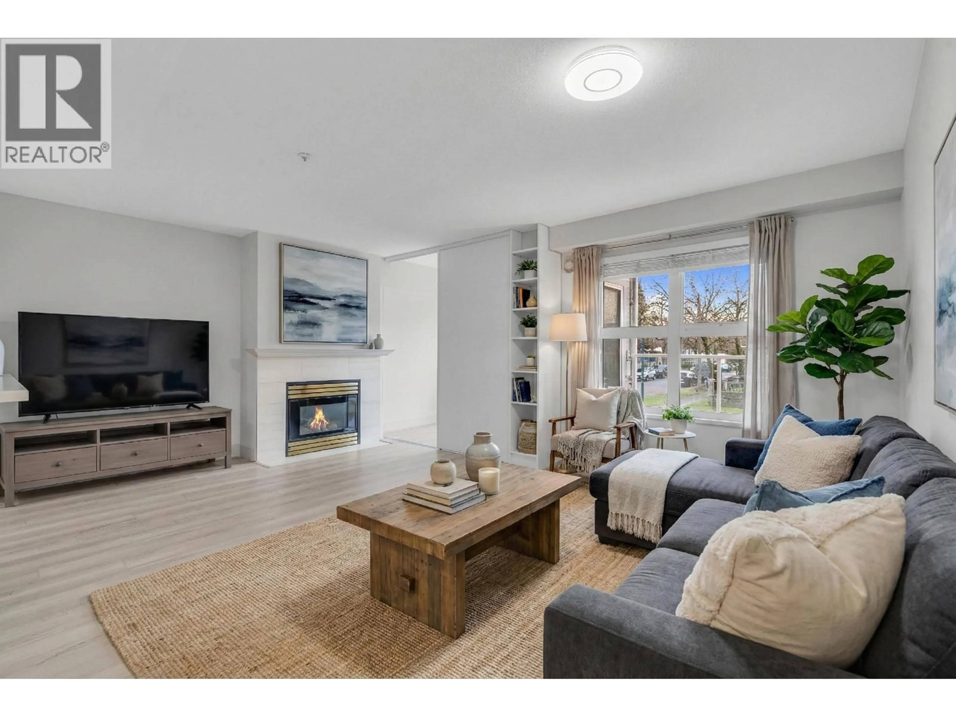 Living room with furniture, unknown for 205 - 2965 HORLEY STREET, Vancouver British Columbia V5R6B9