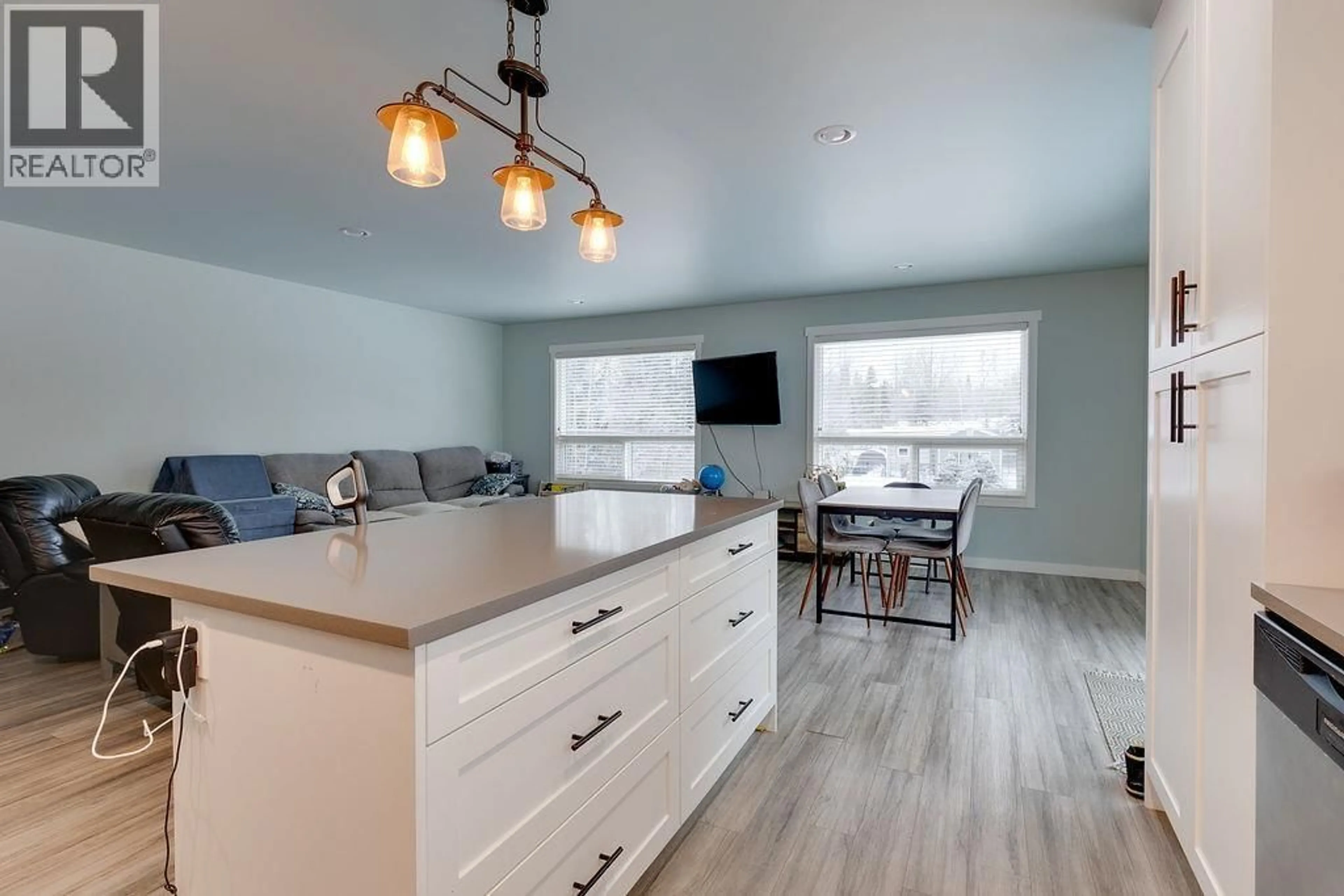 Open concept kitchen, wood/laminate floor for 7014 TAFT DRIVE, Prince George British Columbia V2K2R2