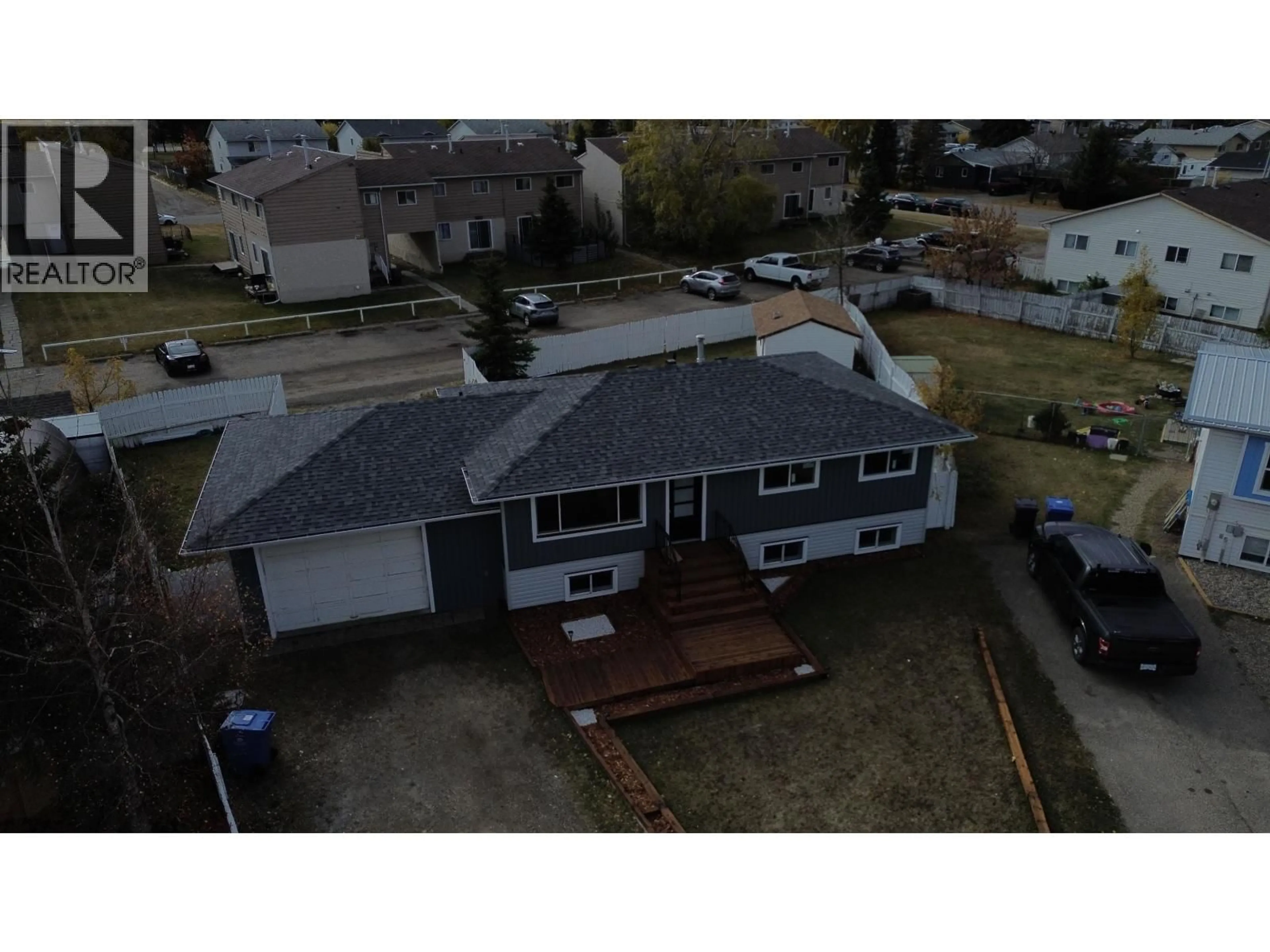 A pic from outside/outdoor area/front of a property/back of a property/a pic from drone, street for 8835 103 AVENUE, Fort St. John British Columbia V1J6P1