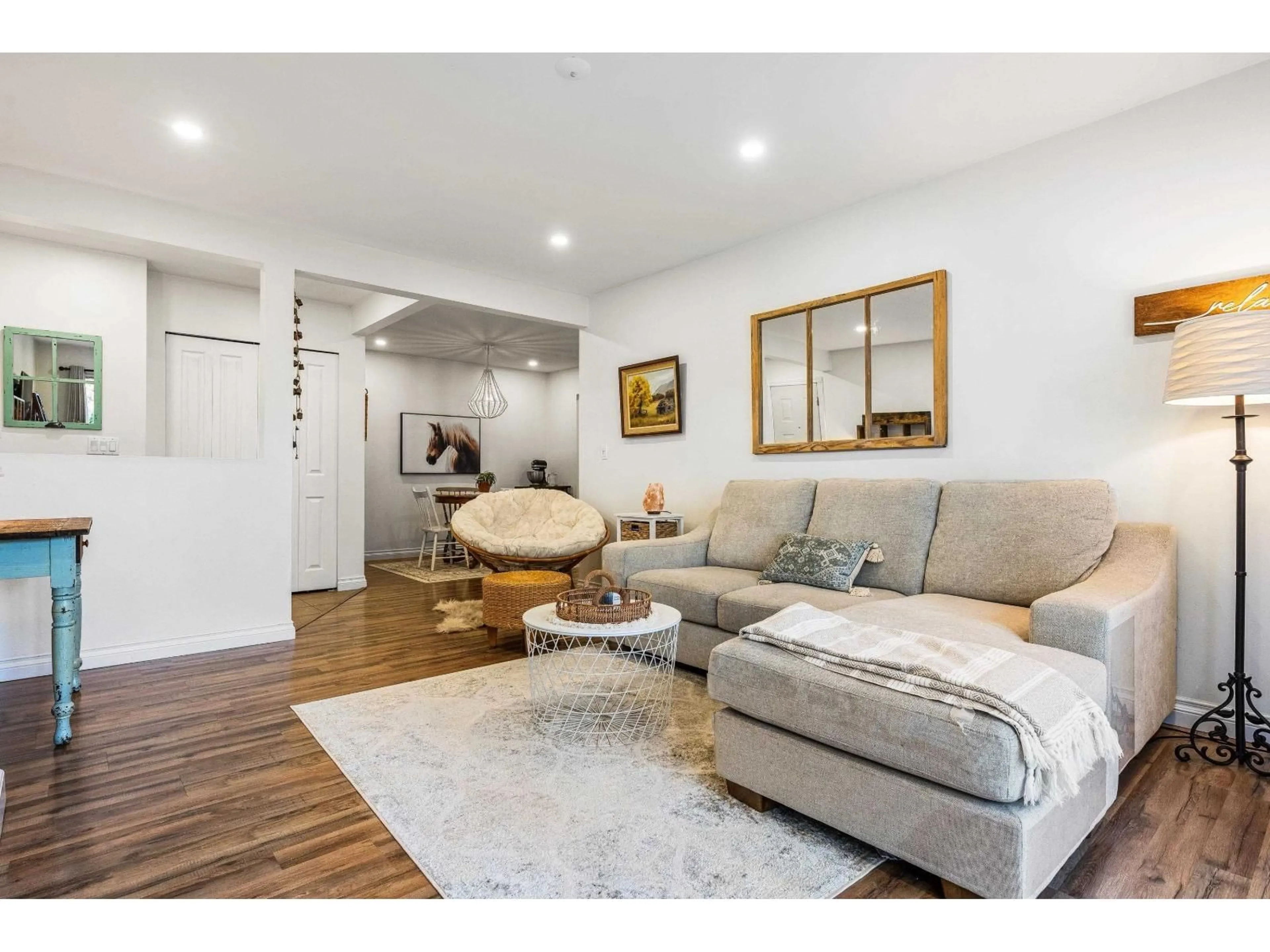 Living room with furniture, wood/laminate floor for 813 - 34909 OLD YALE ROAD, Abbotsford British Columbia V3G2E7