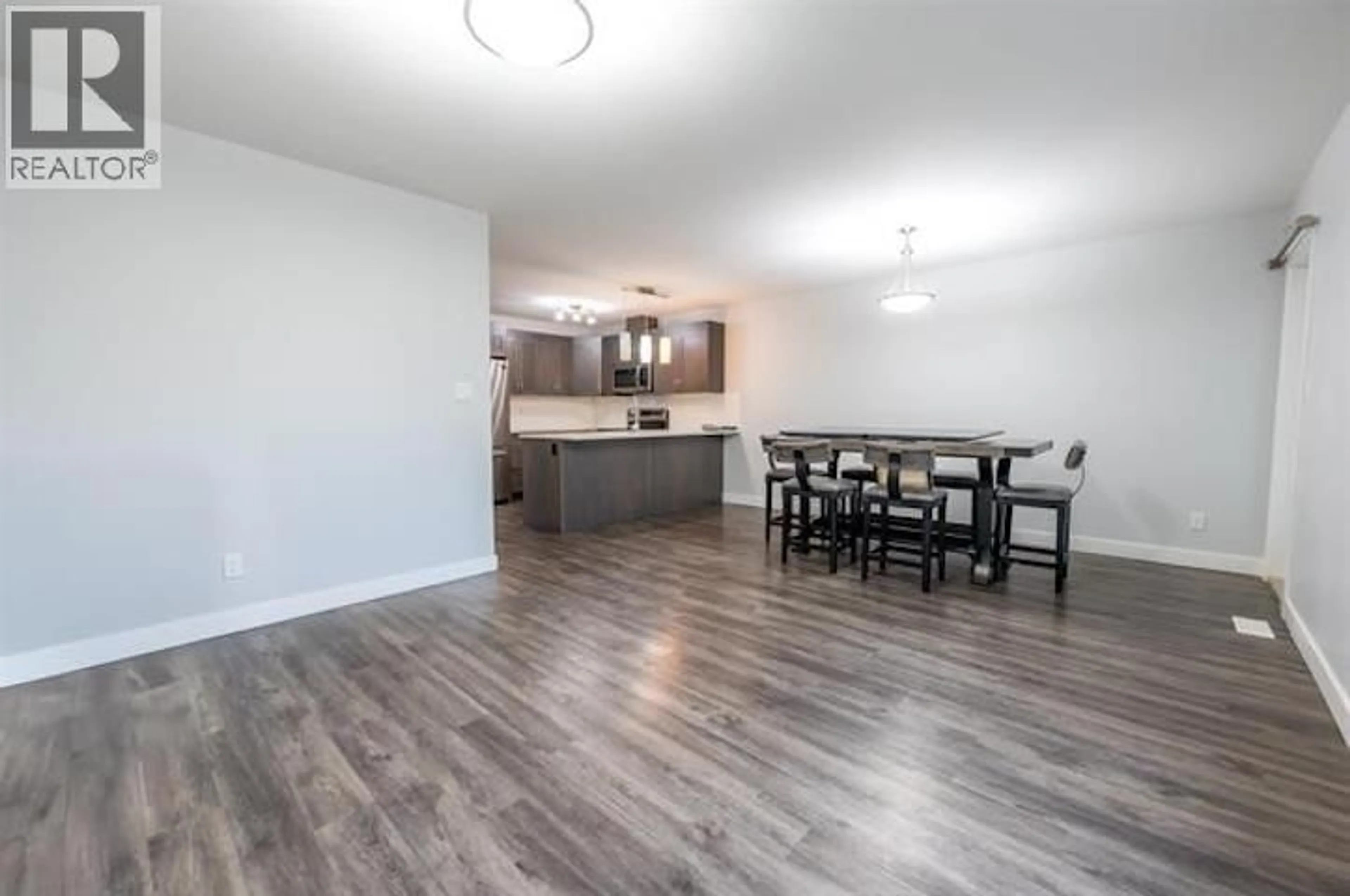 Open concept kitchen, wood/laminate floor for 302 - 6798 WESTGATE AVENUE, Prince George British Columbia V2N0H6