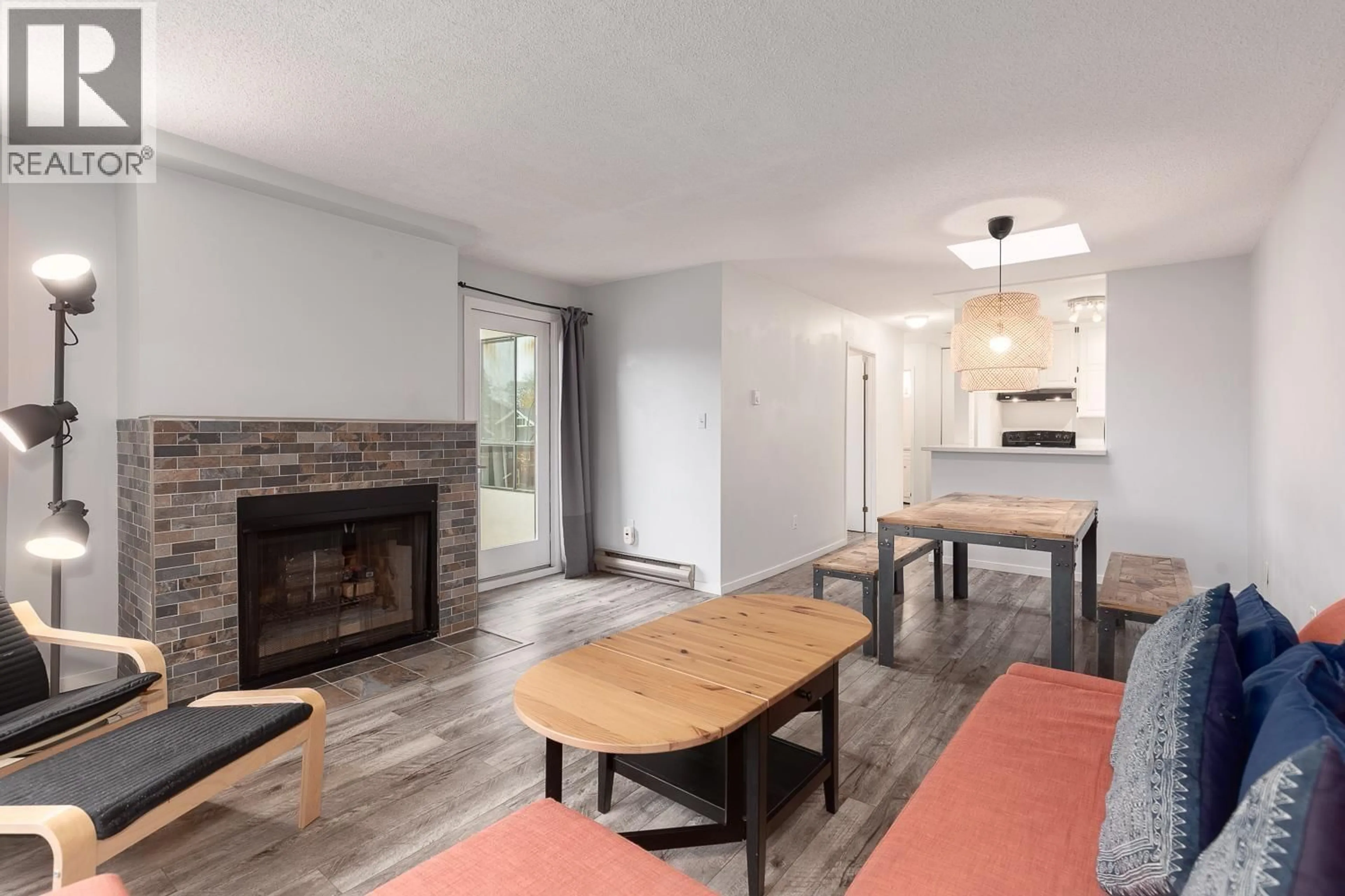 Living room with furniture, wood/laminate floor for 306 - 1775 10TH AVENUE, Vancouver British Columbia V6J2A4