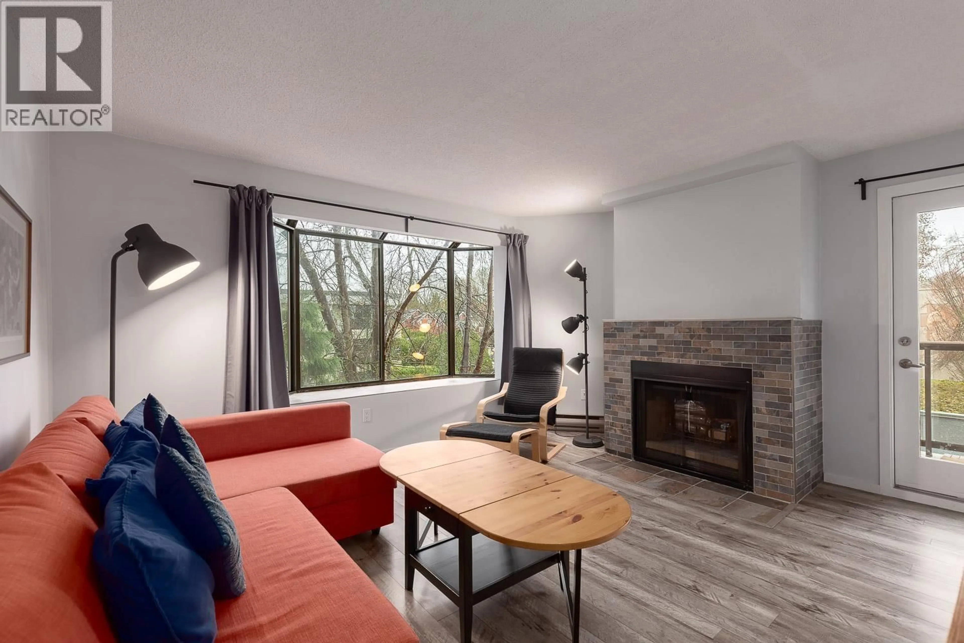 Living room with furniture, wood/laminate floor for 306 - 1775 10TH AVENUE, Vancouver British Columbia V6J2A4