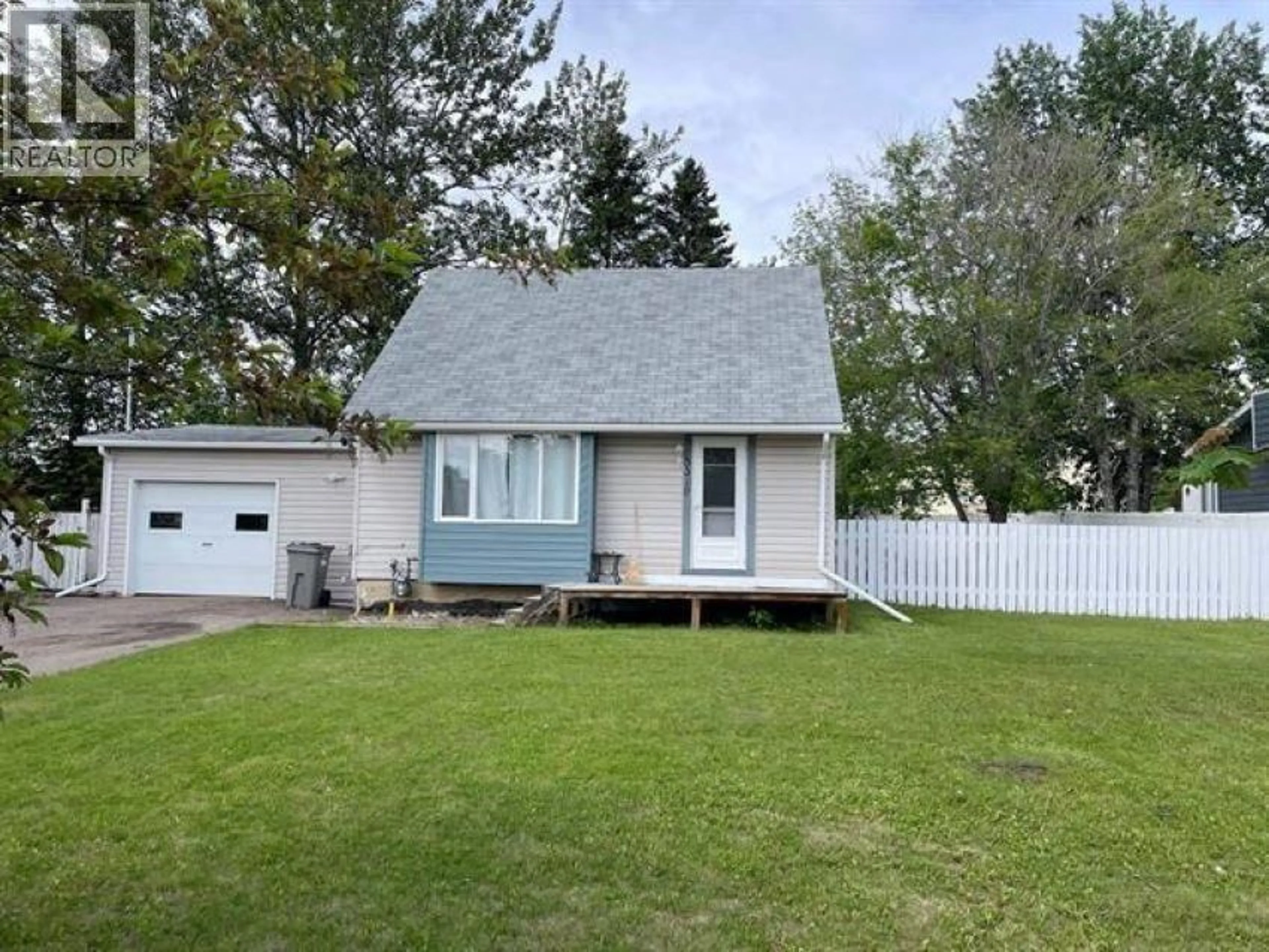 Home with vinyl exterior material, street for 5319 44 STREET, Fort Nelson British Columbia V0C1R0